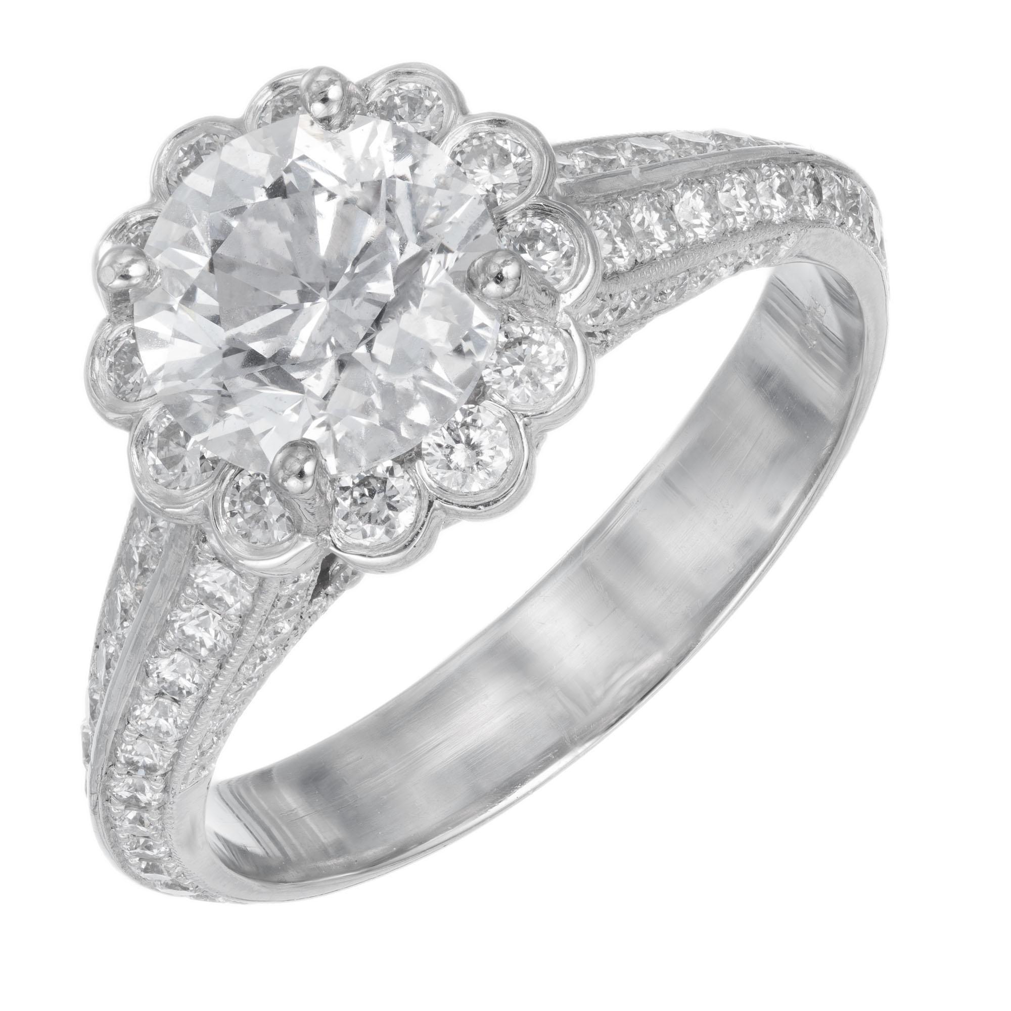 Diamond engagement ring. EGL certified round center stone with a scalloped halo of round diamonds in a  micro pave diamond platinum setting. Created in the Peter Suchy Workshop. 

1 round brilliant cut diamond, approx. total weight 1.55cts, F, I1 