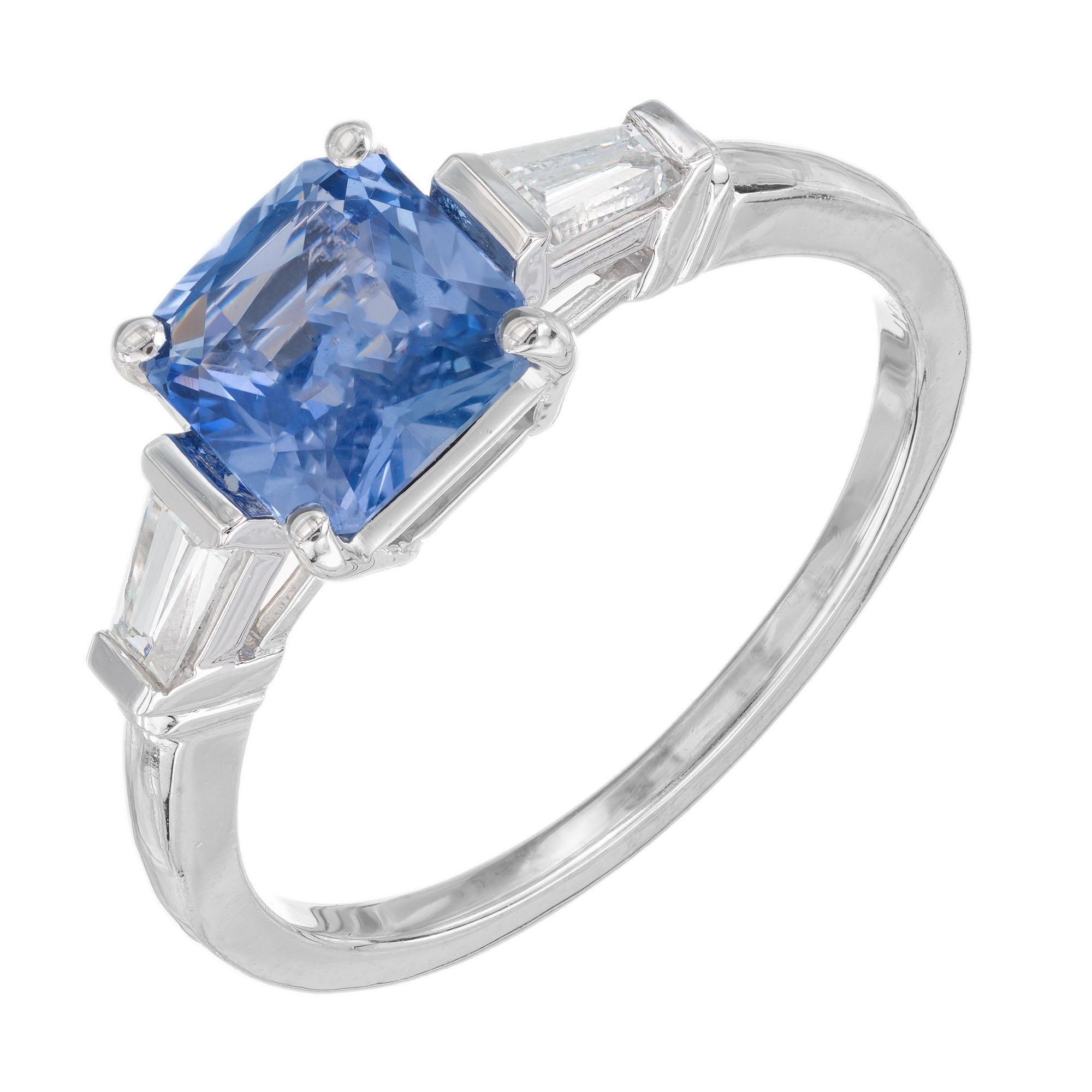 Periwinkle blue Art Deco octagonal step cut 1.55 carat sapphire and diamond engagement setting. The GIA certified center stone is from a 1915 estate. Natural no heat or enhancements. Platinum three-stone setting with two tapered baguette side