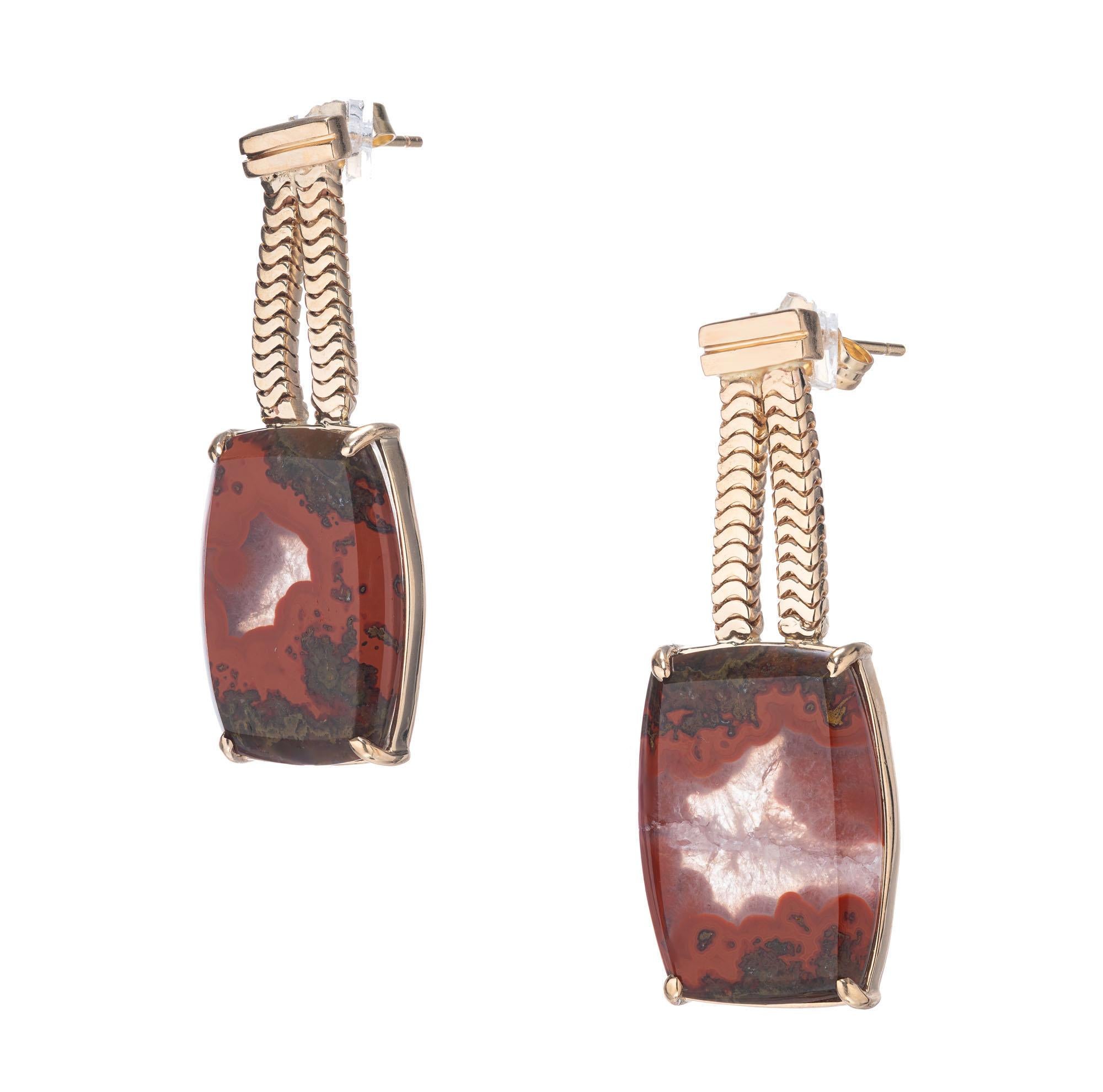 Peter Suchy natural Agate dangle earrings in 14k yellow gold. One of a kind.

2 rectangular greenish brown red Agate, approx. total weight 16.09cts, 19.3 x 14 x 3.1mm
Tested: 14k
14k yellow gold
9.6 grams
Width: 14.3mm or .56 Inch
Depth: 4.5mm

