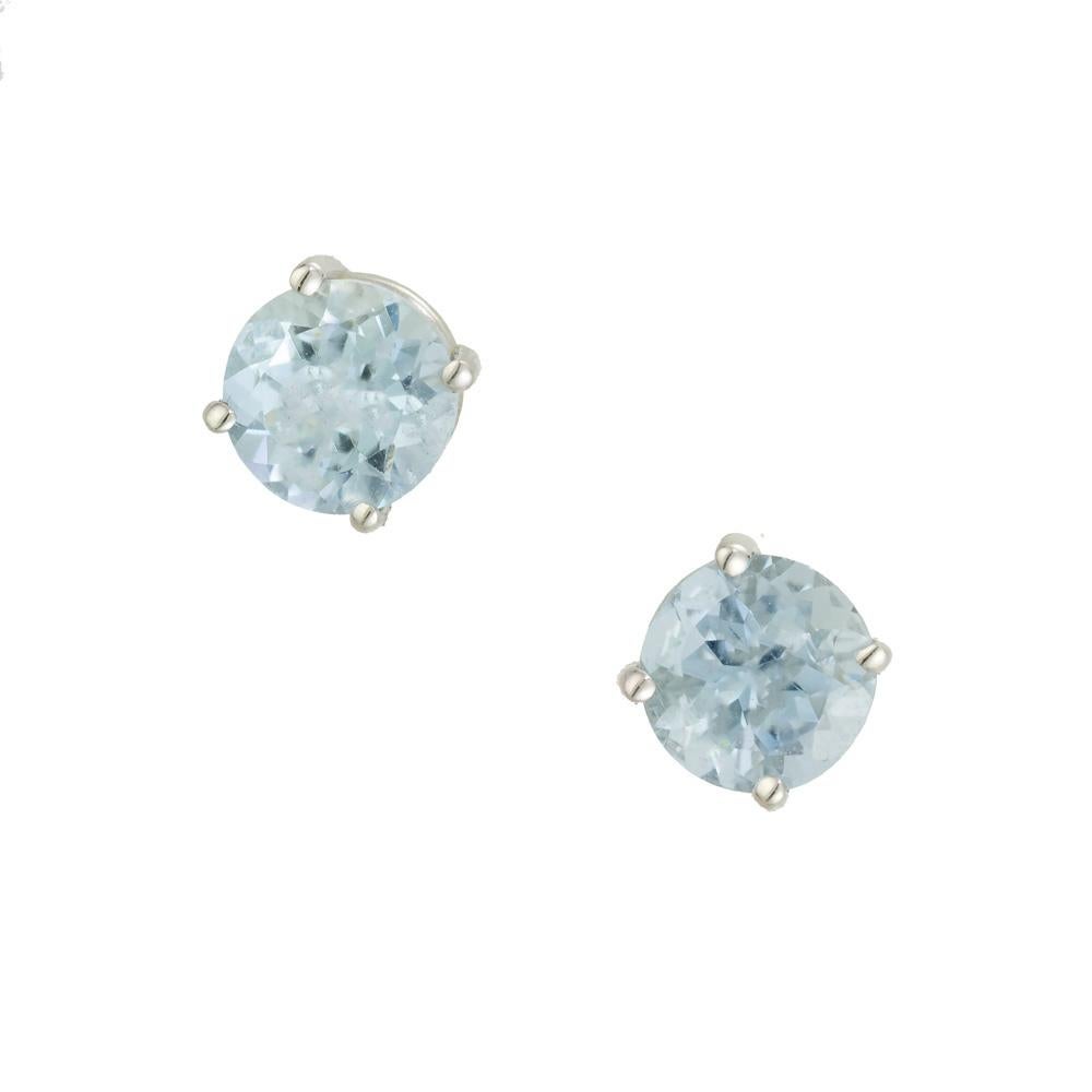 Aqua stud earrings. 2 round cut blue aqua stones set in 14k white gold 4 prong basket settings. Designed and crafted in the Peter Suchy Workshop.

2 round blue aqua, approx. 1.63cts
14k white gold 
Stamped: 14k
1.5 grams
Top to bottom: 6.1mm or .25