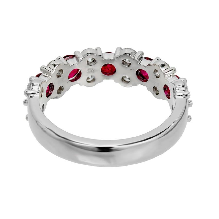 Peter Suchy Designs, 3 row Diamond and Ruby wedding band ring. Set comfortably low to the finger with a minimum amount of metal. Mounted with 5 round cut rubies totaling 1.00cts. Each ruby is separated by round cut double diamonds.  Half way around.