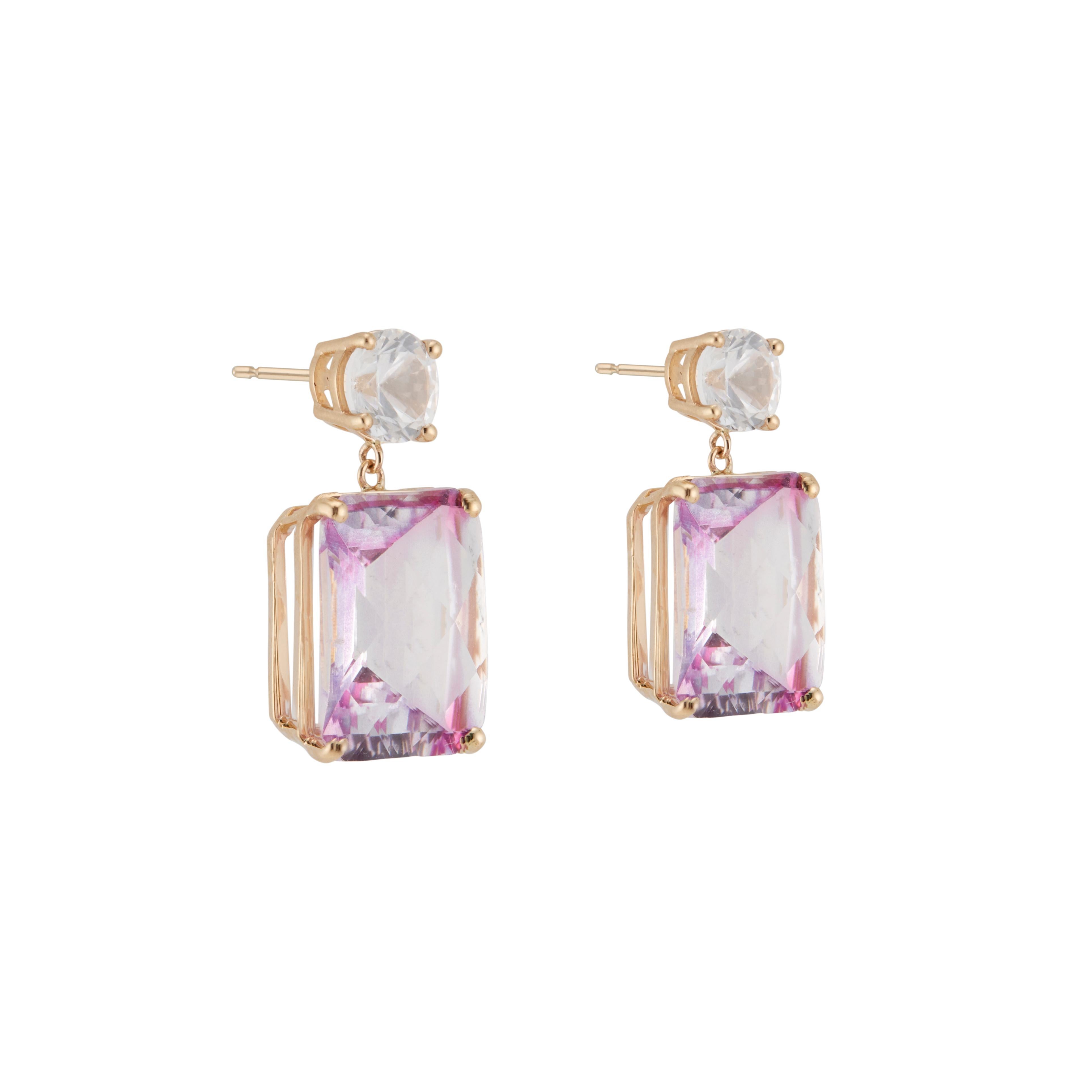 Topaz and diamond dangle earrings. 2 rectangular pink topaz set in 14k yellow gold with 2 white sapphires. Designed and crafted in the Peter Suchy workshop.

2 round white sapphires, VS approx. 2.04cts
2 rectangular pink topaz, VS-SI approx.