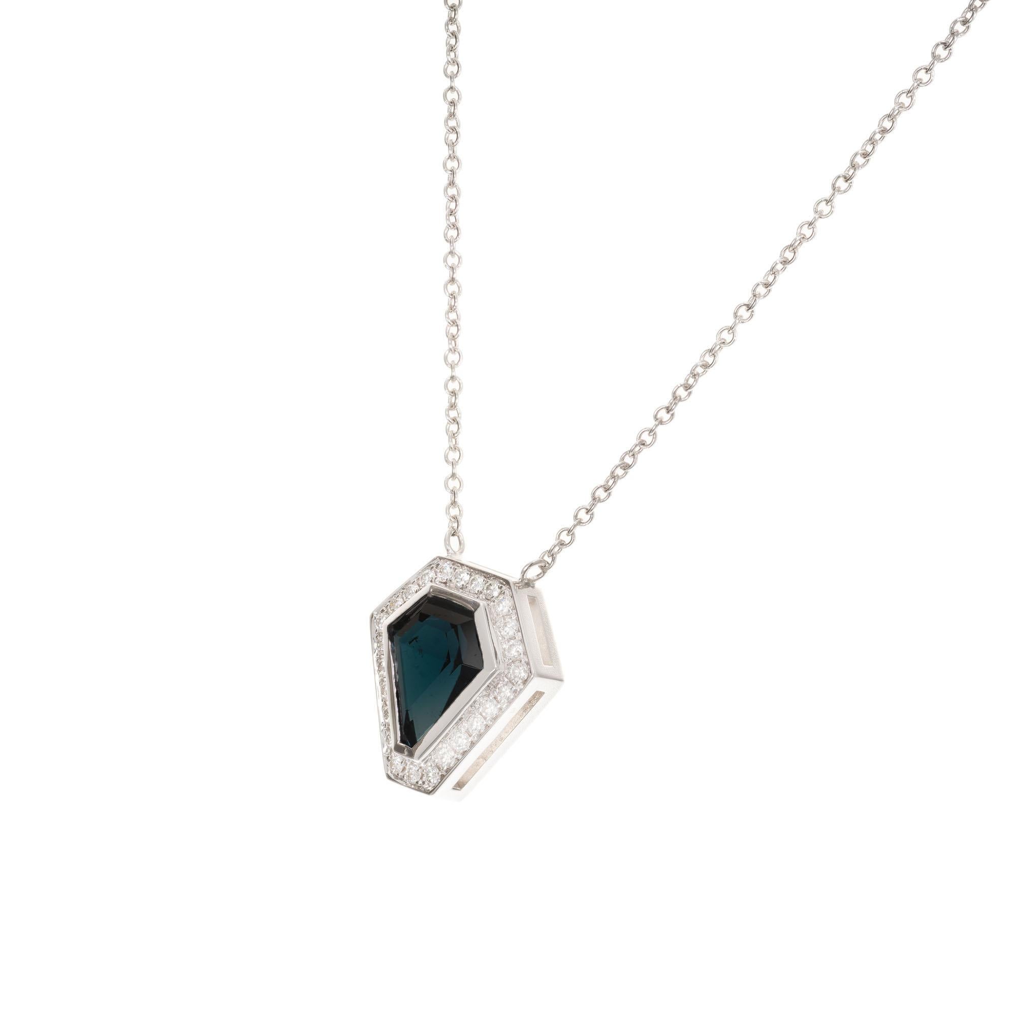 1.75 carat Indicolite blue kite shape tourmaline and diamond pendant necklace. The tourmaline is from a 1920’s estate set in a hand made simple diamond halo 18k white gold setting, crafted in the Peter Suchy Workshop. 16 inch chain. 

1 kite shape