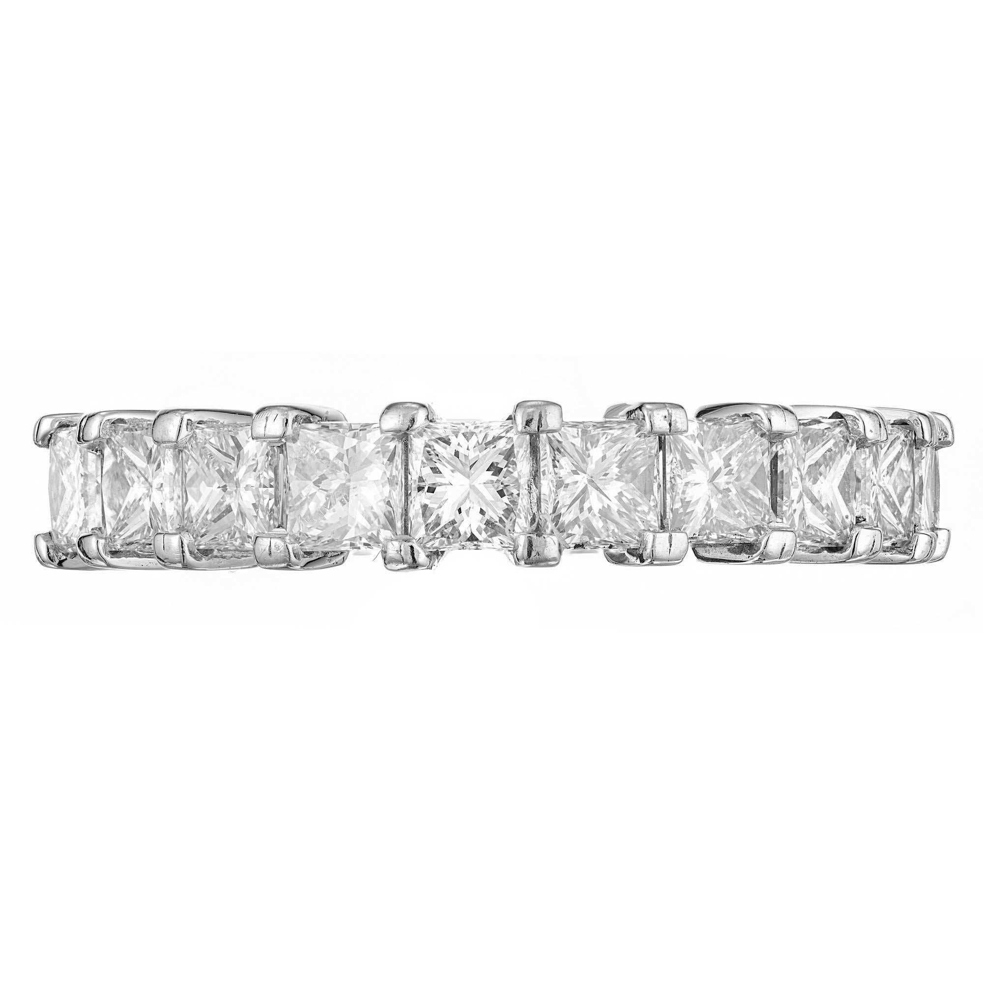 Princess cut diamond wedding band. 11 diamonds in a common prong set platinum setting that goes half way across the finger. Set low to the finger. Crafted by the Peter Suchy Workshop.

11 Princess cut diamonds, approx. total weight 1.75cts, F, VS1