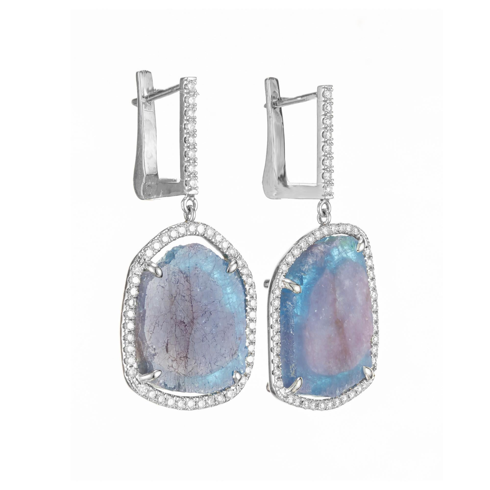 Tourmaline and diamond halo dangle earrings. AGL certified natural no heat Paraiba Brazilian Tourmaline crystal slices with pink, purple and blue translucent colors.  These unique uncut tourmalines are set in 18k white gold diamond halo settings