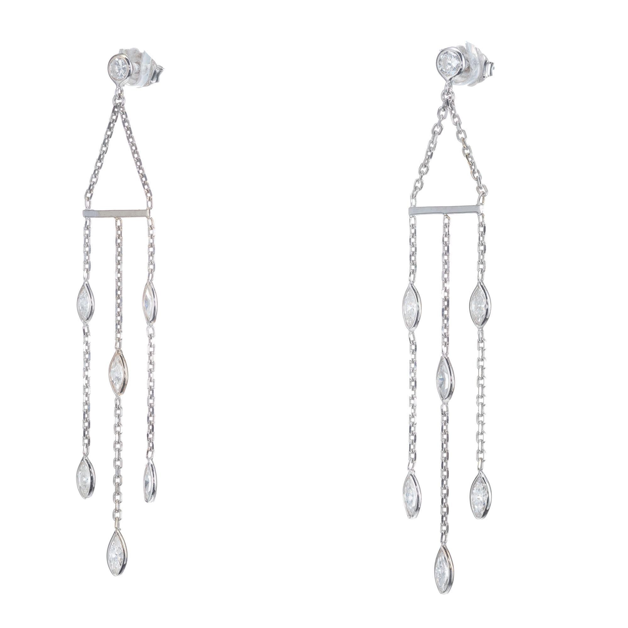 Art Deco styled Diamond By The Yard dangle earrings with round and marquise diamonds. Set in 14k white gold. Created in the Peter Suchy Workshop. 

2 round brilliant cut diamonds, approx. total weight .30cts, G-H, VS to SI, excellent brilliance
12