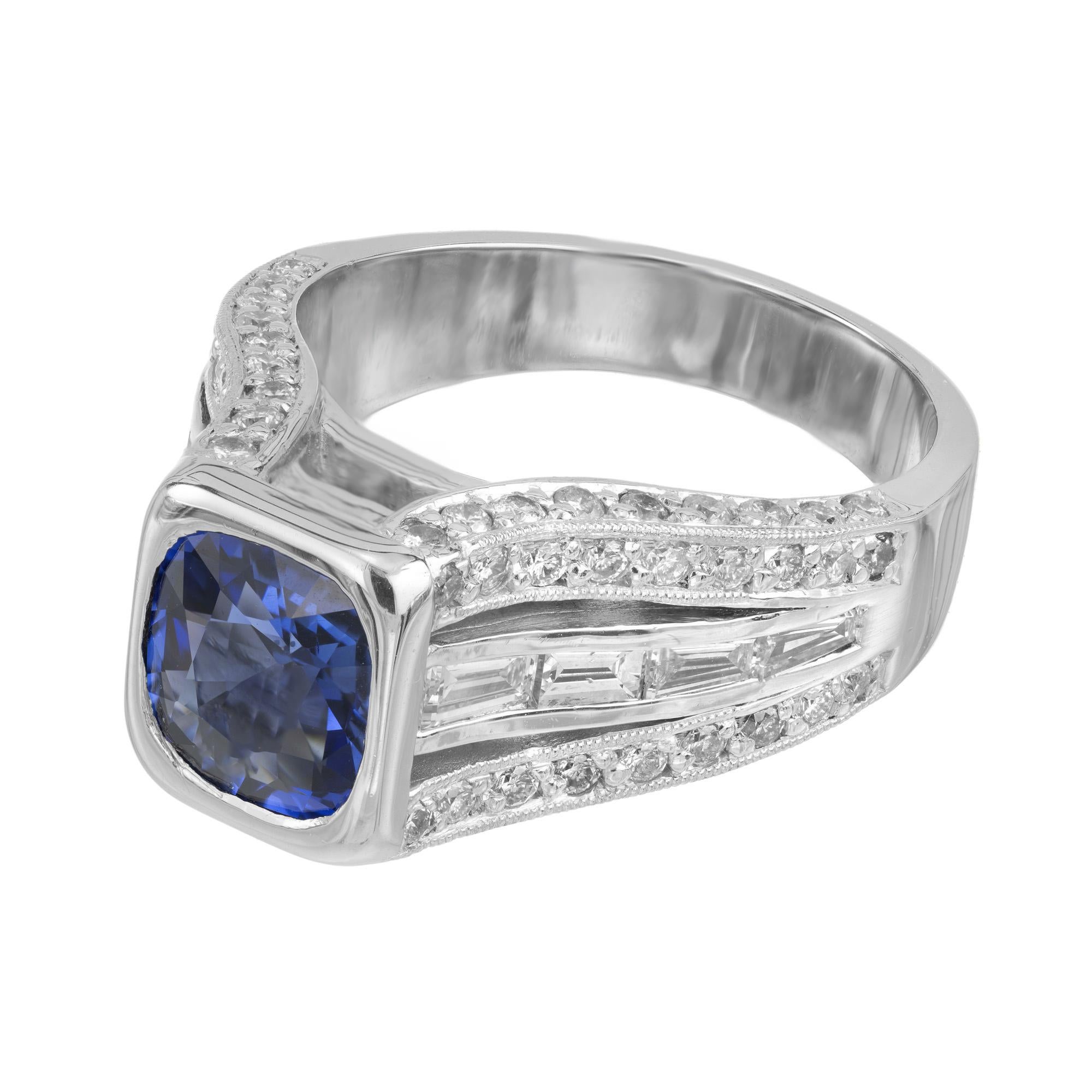 Peter Suchy bezel set Sapphire and Diamond platinum engagement Ring. Featuring a stunning 1.98 carat cushion-cut sapphire elegantly set in lustrous platinum mounting and accented with 8 tapered baguette diamonds and 72 round full cut diamonds. The