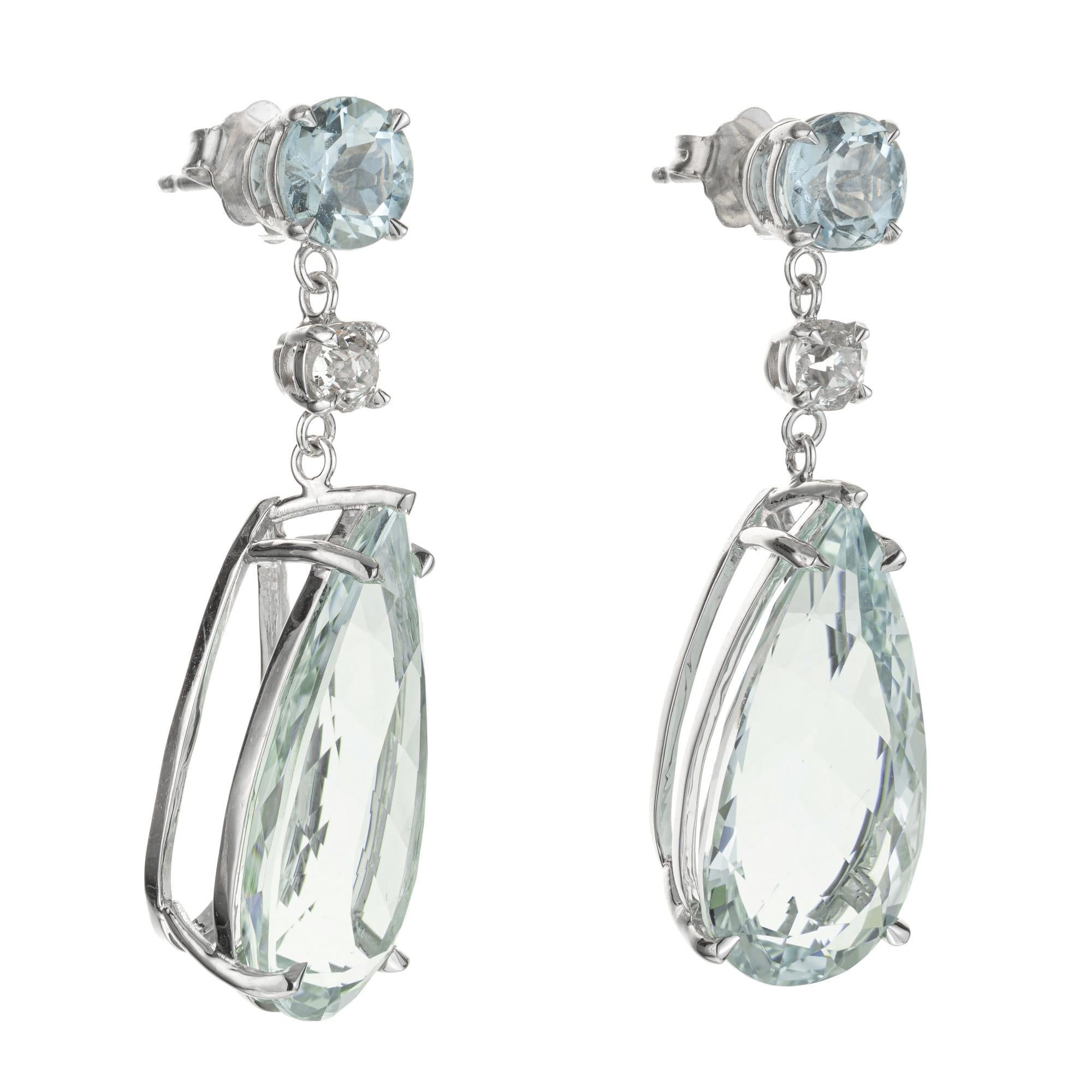 Soft bright greenish blue natural untreated aqua and diamond dangle earrings. Two pear shaped 18.42ct. aquamarine dangles with 2 round aqua's and 2 round mine cut diamonds in 18k white gold settings. The stones are from the 1950's and the earrings