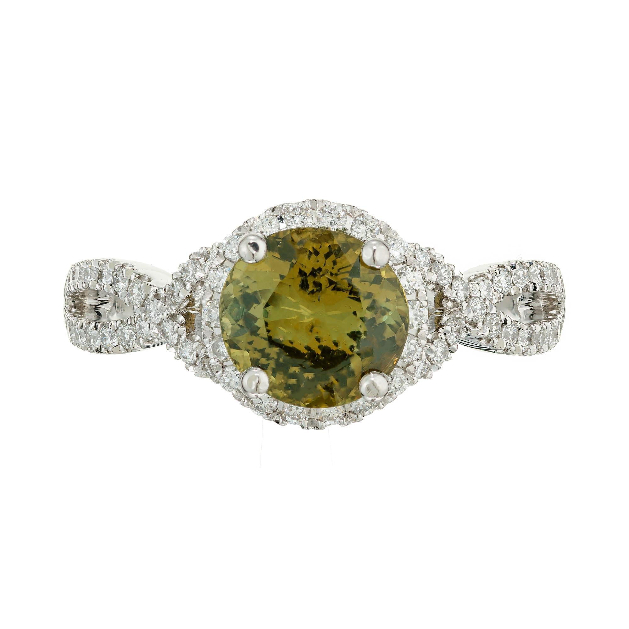 Alexandrite and diamond halo engagement ring. GIA certified natural 2.08 carat round greenish yellow color change Alexandrite center stone, in a platinum setting with a diamond halo and split shank accented with diamonds. Created in the Peter Suchy.
