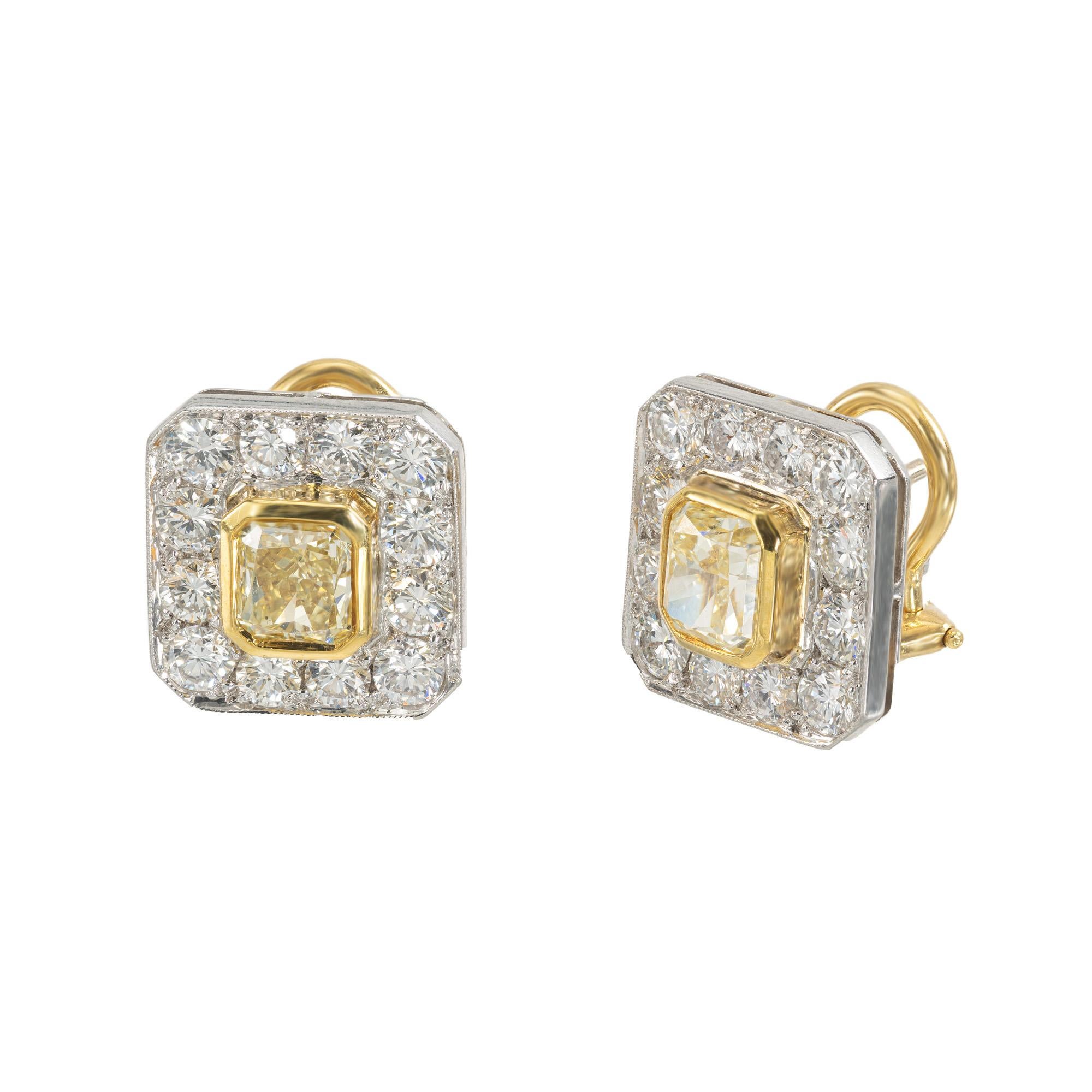 Crafted to dazzle and delight, these Peter Suchy clip post earrings are a true testament to elegance. Featuring two stunning 18k yellow gold bezel set, radiant cut yellow diamonds totaling 2.17cts. Each diamond has a halo of 12 white round brilliant