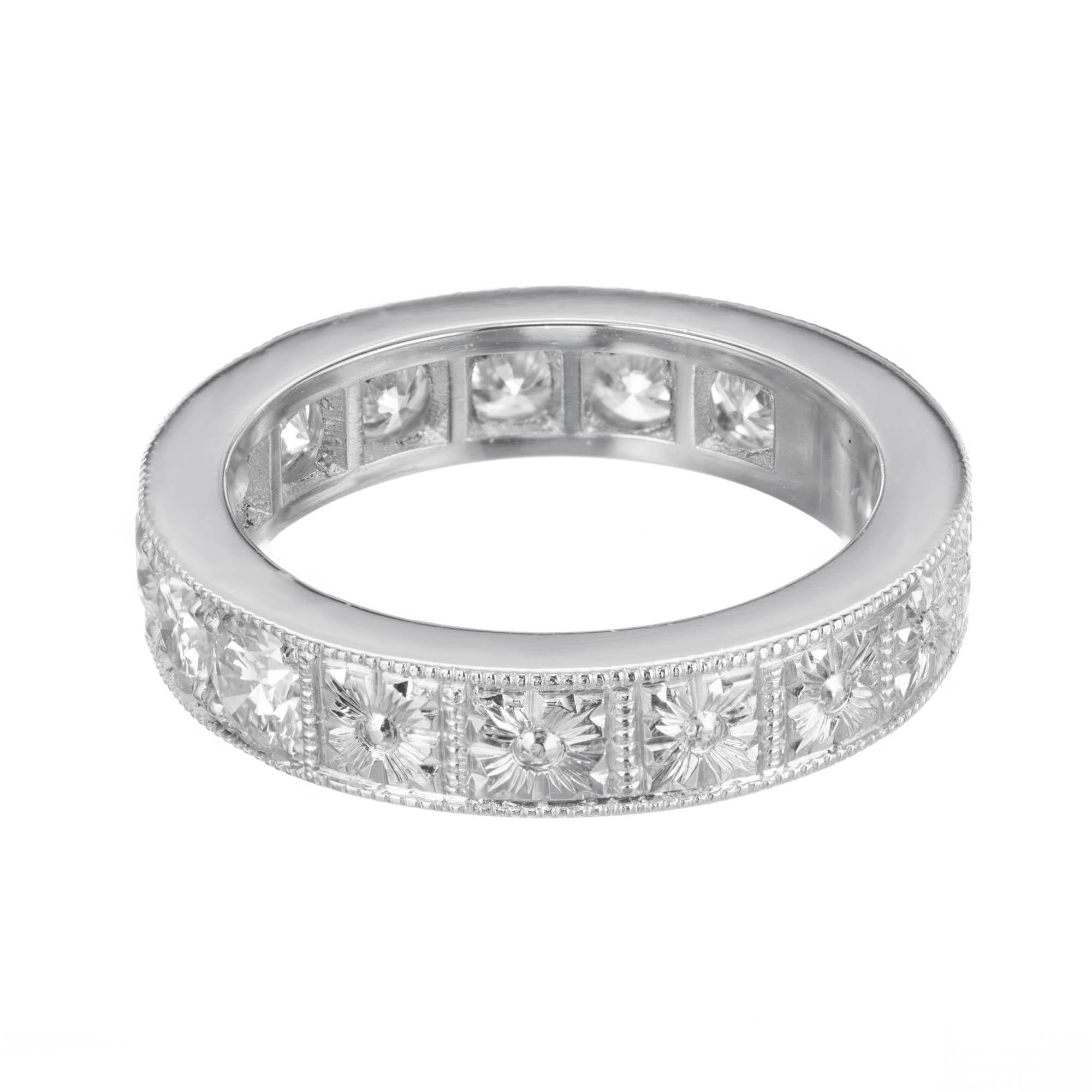  Peter Suchy Vintage Inspired custom made wedding ring with 2.20ct of bead set Diamonds, F color, VS to SI1 clarity. The Diamonds go past half way around with engraving at the bottom. Flat 4.26mm wide ring. 
 
9 round Diamonds, approx. total weight
