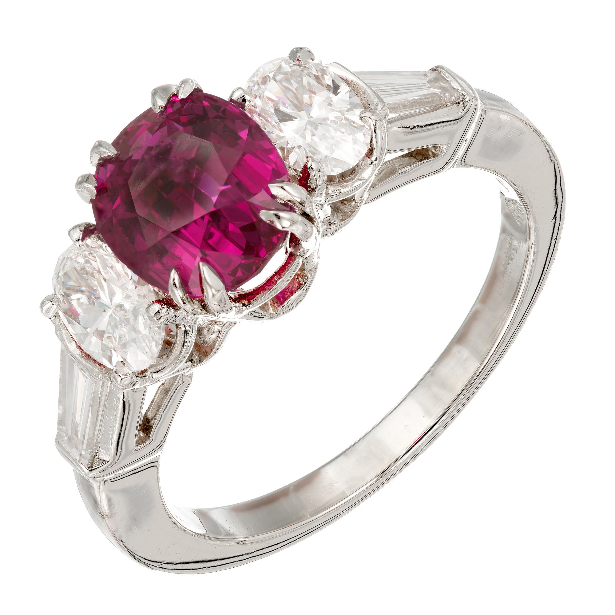 Peter Suchy Ruby and diamond engagement ring. GIA certified Burma Myanmar Ruby.  Bright vivid red center simple low level heat only ruby with four round and baguette side diamonds in a handmade Platinum setting. 

1 oval brilliant cut gem purplish