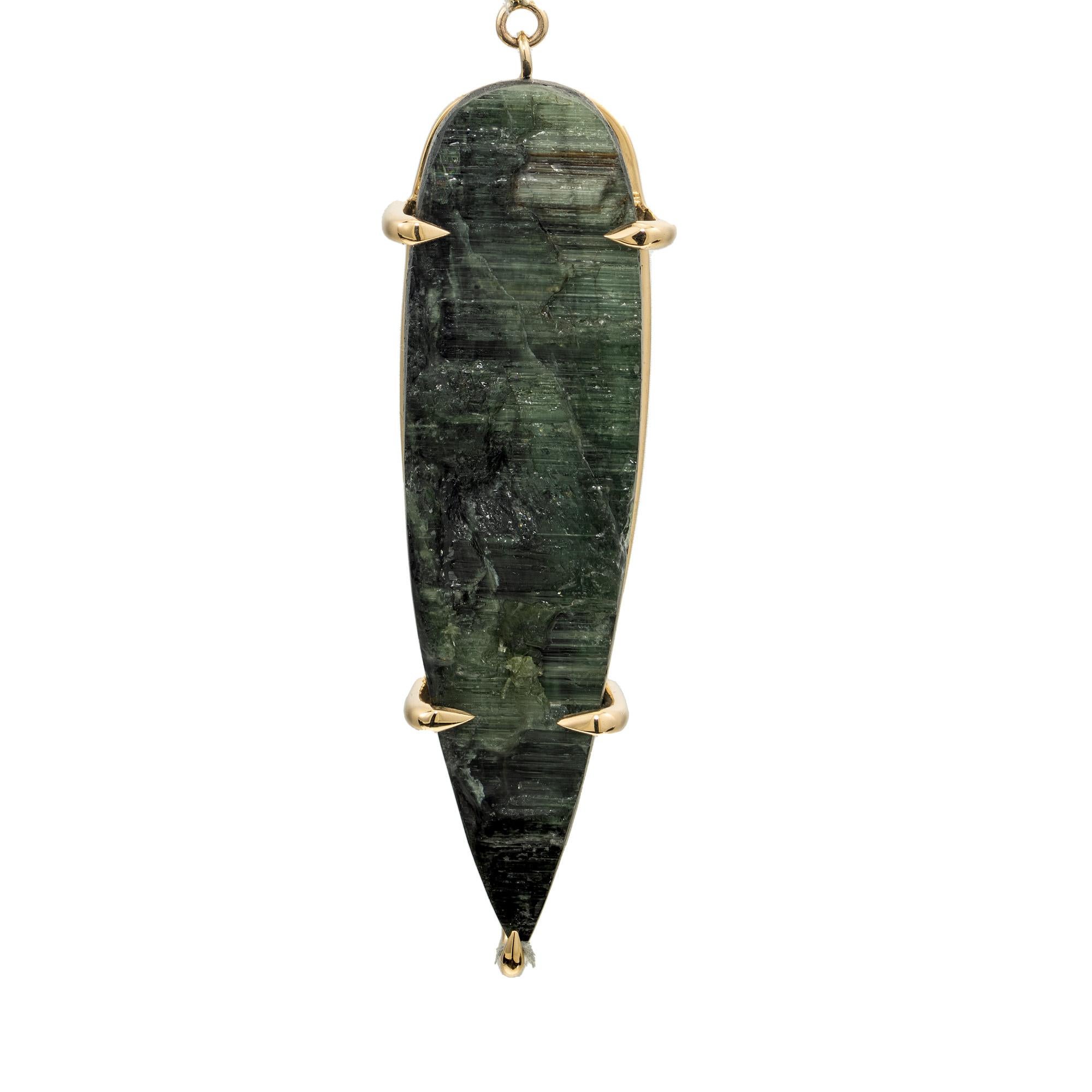Rare, All natural untreated one of a king gemstones in a handmade pendant. The energy of these three stones blend perfectly, starting with a 23.14 carat pear shaped green tourmaline set in 18k yellow gold and accented with one flame cut pink topaz
