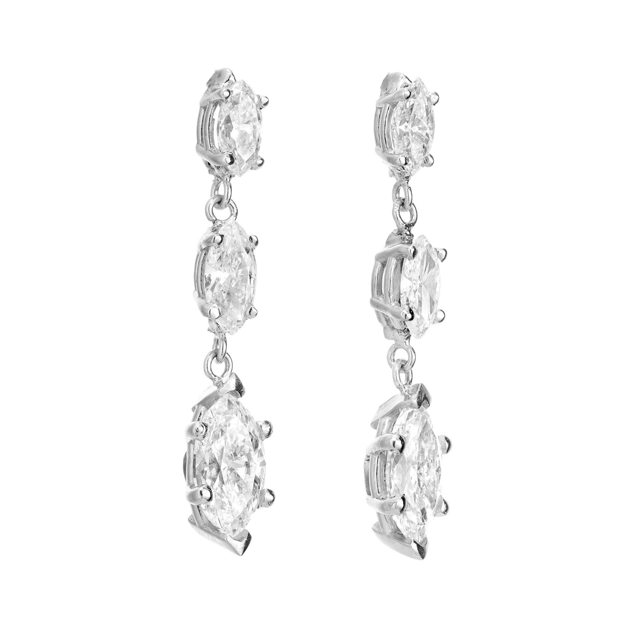 Peter Suchy triple marquise Diamond dangle drop earrings. Each earring features three graduated marquise cut diamonds mounted in platinum settings created in the Peter Suchy Workshop. The diamonds are graded by the EGL and range from colorless to