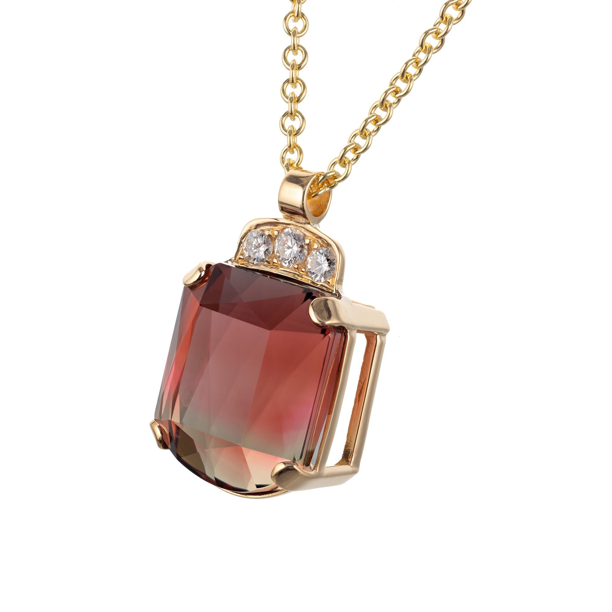 24.39 carat custom cut pink tourmaline and diamond pendant necklace. 18k yellow gold pendant setting with a tourmaline center stone with diamond accents. Created in the Peter Suchy workshop.

1 shield cut brownish pink tourmaline, Approximate