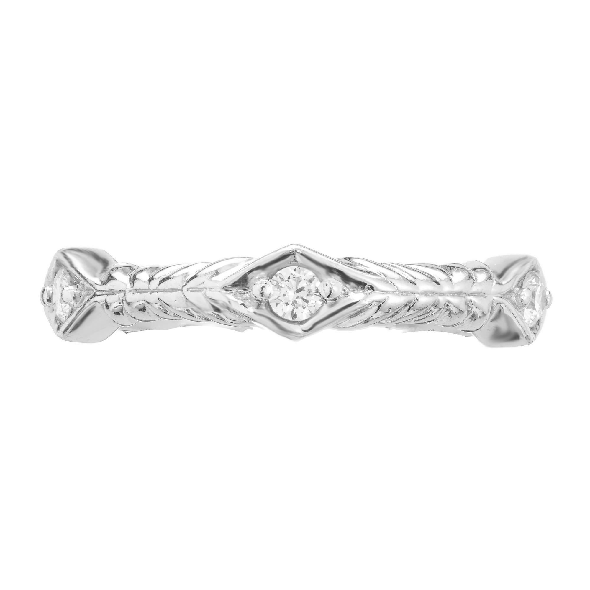 Alternative eternity diamond wedding band ring. 5 round brilliant cut diamonds set in a solid platinum setting. The diamonds are set in marquise shaped sections separated by grooved sections. This ring is not size able but can be custom ordered in