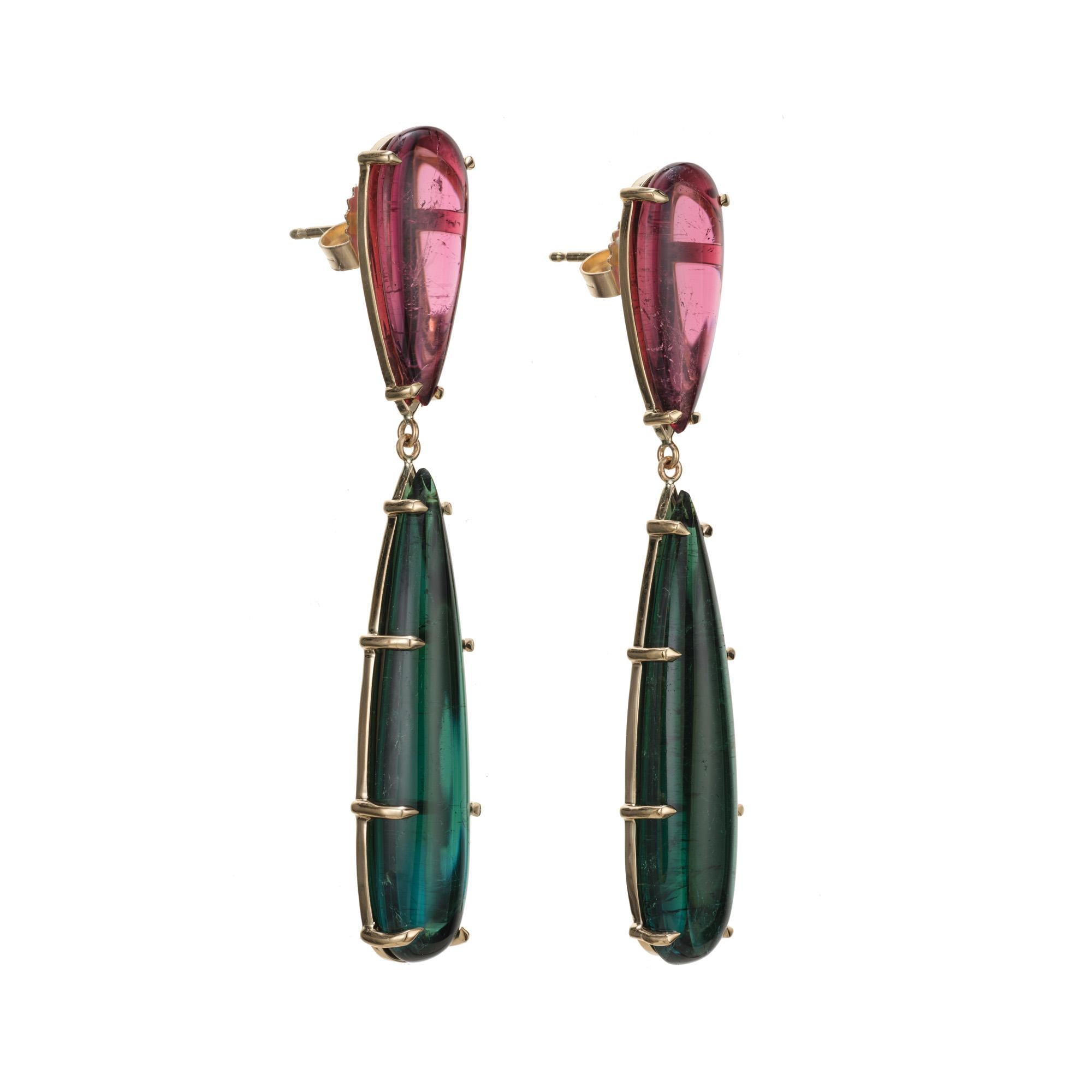 Untreated natural color pink and green tourmaline dangle earrings. 2 natural pink pear shaped tourmalines totaling 7.15cts each with a green blue pear shaped tourmaline dangle totaling 18.31cts.  Designed and crafted in the Peter Suchy workshop.

2