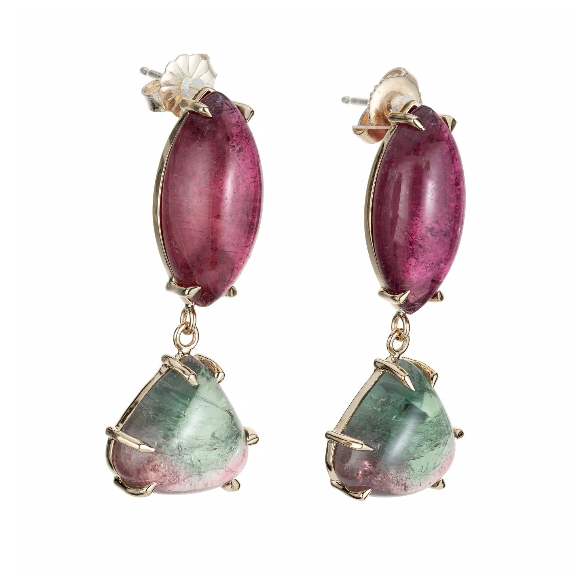 Tourmaline dangle earrings. 2 marquise shaped red/pink tourmalines with 2 triangle shaped watermelon tourmaline dangles set in 14k yellow gold settings. Designed and crafted in the Peter Suchy workshop

2 marquise shaped pinkish red tourmaline,