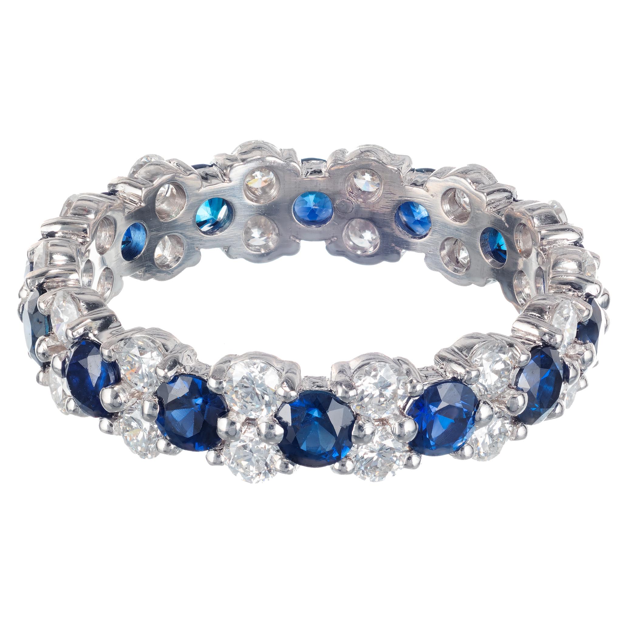 Sapphire and diamond eternity wedding band. 14 round sapphires in a platinum setting separated with 28 round, double stacked diamonds.  Designed in the Peter Suchy Workshop. 

14 round sapphires 1.50cts 2.8x2.8
28 round diamonds 1.10cts  E-F VS
Size