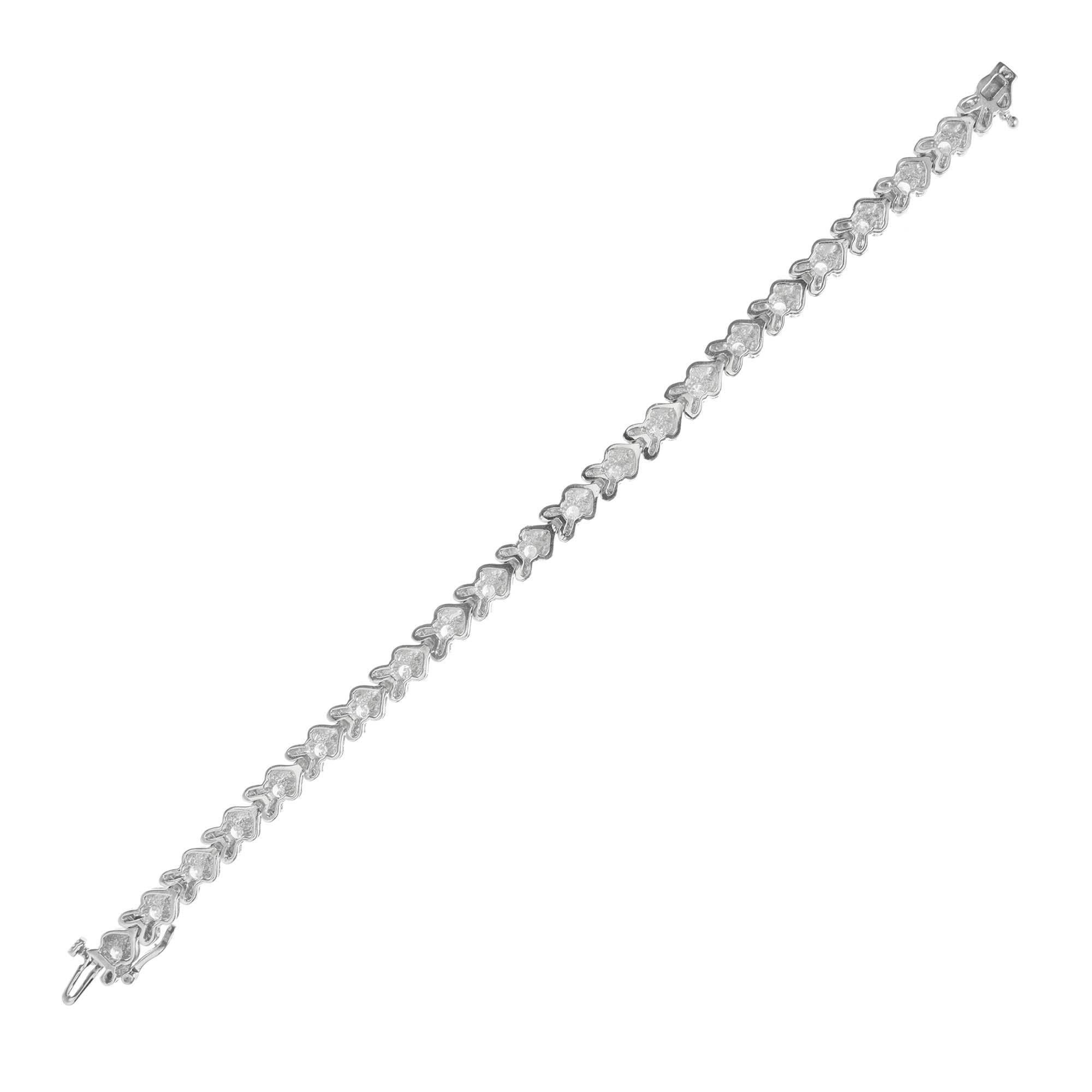 Peter Suchy Chevron Design diamond 14k white gold link bracelet with built in box catch and secure side lock safety.  The bracelet is set with well-cut high grade full cut sparkly diamonds.

22 round full cut diamonds F VS2- SI1 approximate 2.65