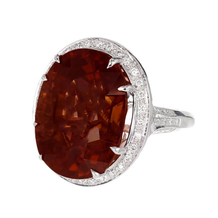 Peter Suchy natural untreated large oval 26.79ct Tourmaline and diamond cocktail ring. 18k white gold setting with a diamond halo. GIA certified as natural. The stone is a true bi-color with pinkish brown towards both ends and brown in the middle.