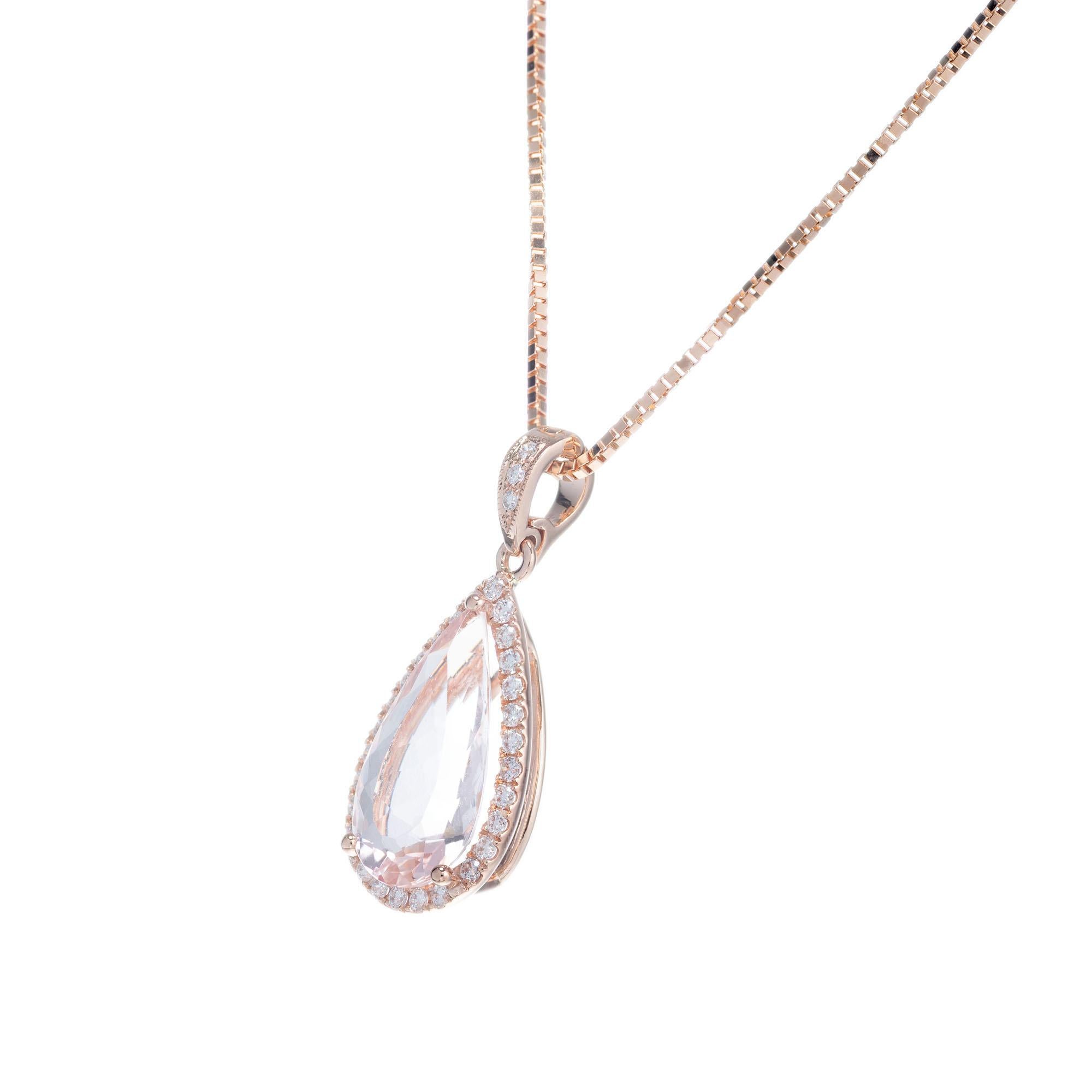 Pear shape 2.68 carat morganite surrounded by a halo of full cut diamonds, in a rose gold pendant necklace setting from the Peter Suchy Workshop. 16 inch 14k rose gold box chain

1 pear shape pink morganite, approx. 2.68cts
31 round brilliant cut