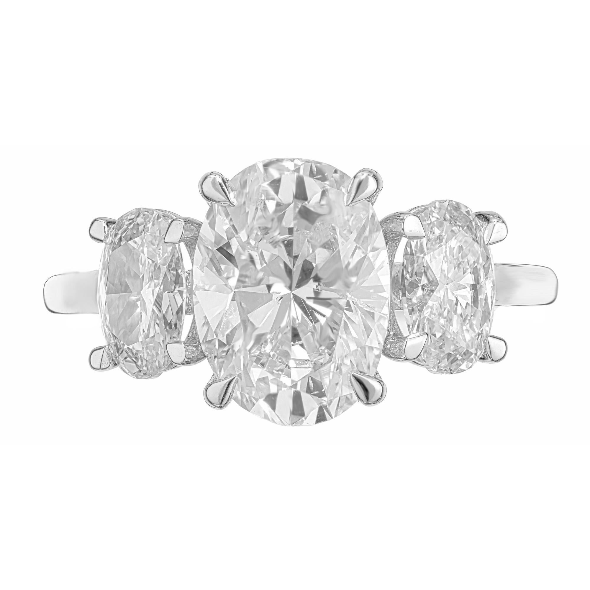 Indulge in timeless elegance with the Peter Suchy GIA certified Diamond Platinum engagement ring. This stunning piece is a masterpiece of craftsmanship. At the center is a 2.80ct oval shape diamond, certified by the GIA as H color, near colorless