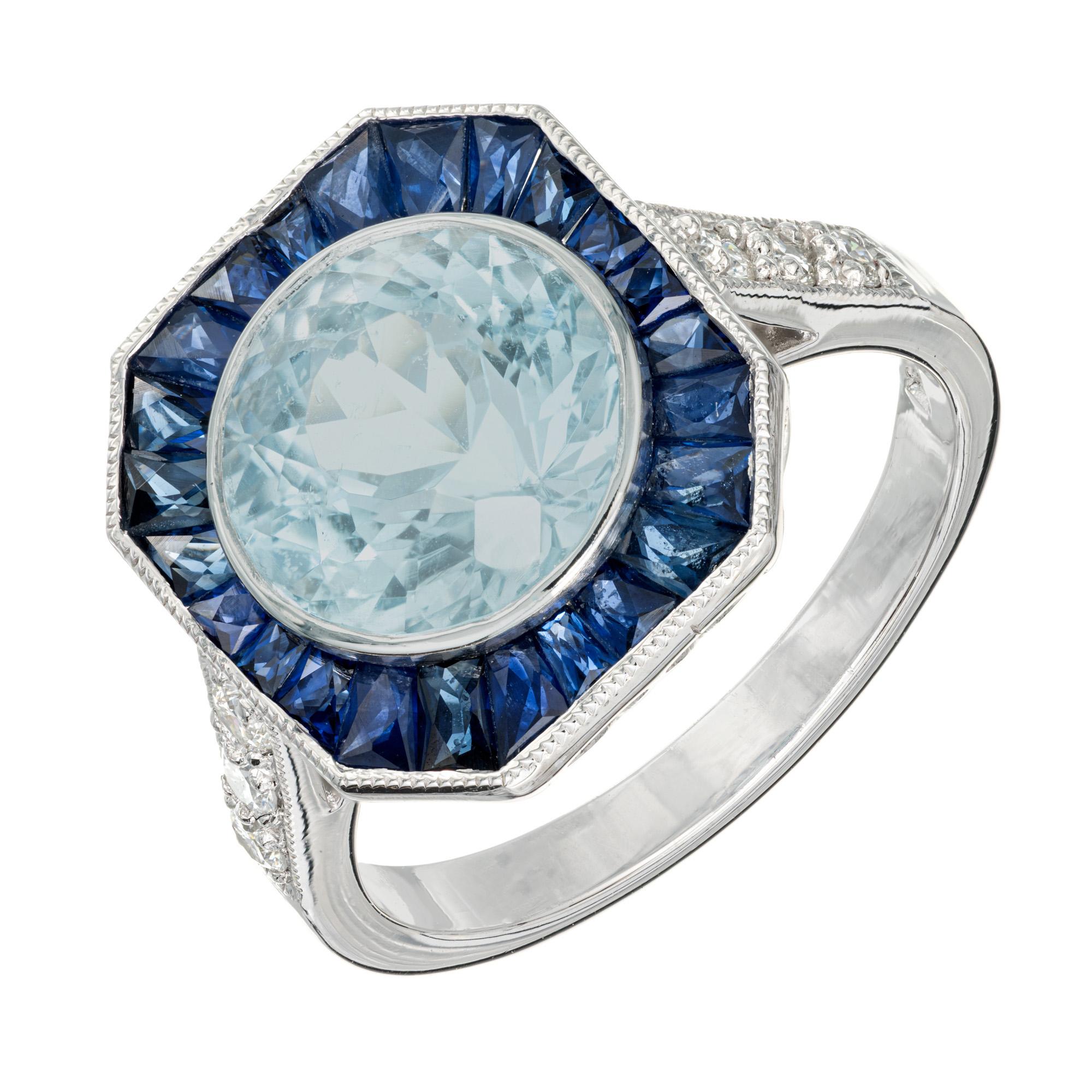Top gem quality round European cut natural Santa Maria 2.96ct aquamarine from the early 1900's, with a halo of French cut tapered baguette  sapphires, set in a platinum setting with 3 round diamonds on each shoulder. Designed and crafted in the