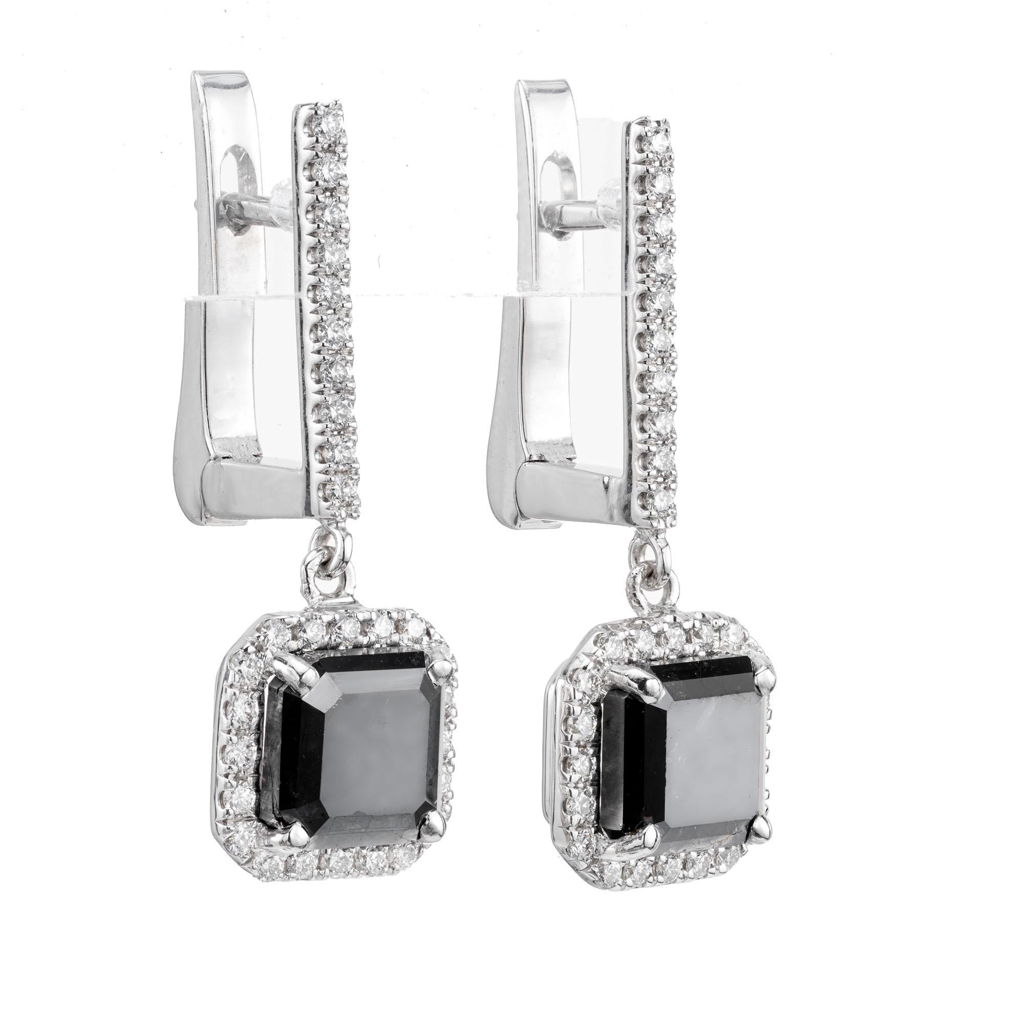 Square black diamond and round white diamond dangle earrings. 2 center square black diamonds with white diamond halos and diamond clip post tops. Designed in the Peter Suchy Workshop.

2 square black diamonds, Included approx.  2.97cts
60 round