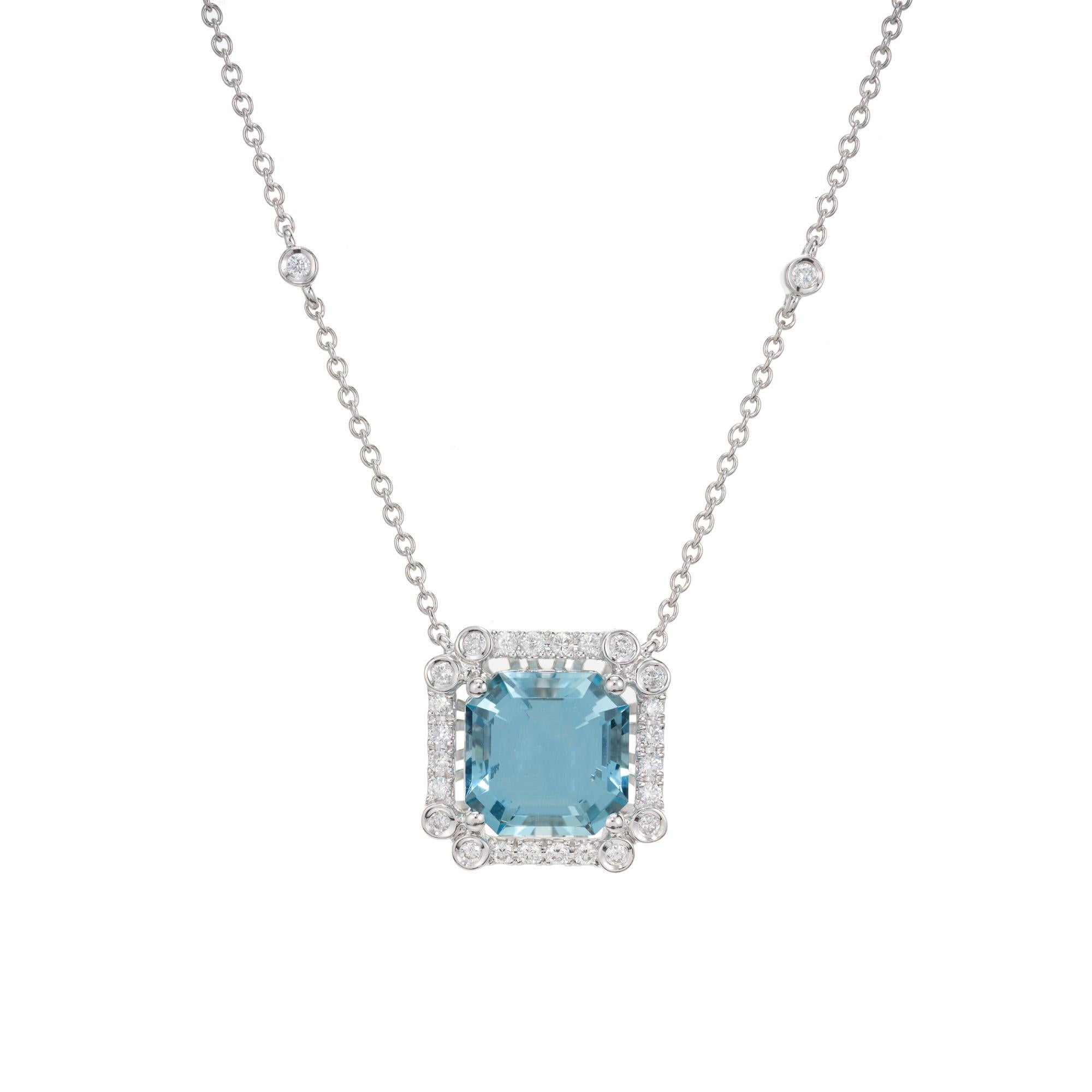Aqua and diamond pendant necklace. 3.02ct bright blue aquamarine with a halo of 26 round diamonds set in a 18k white gold frame. 18k white gold chain with 2 bezel set  accent diamonds. The aqua is from a 1920's estate made into an Art Deco style