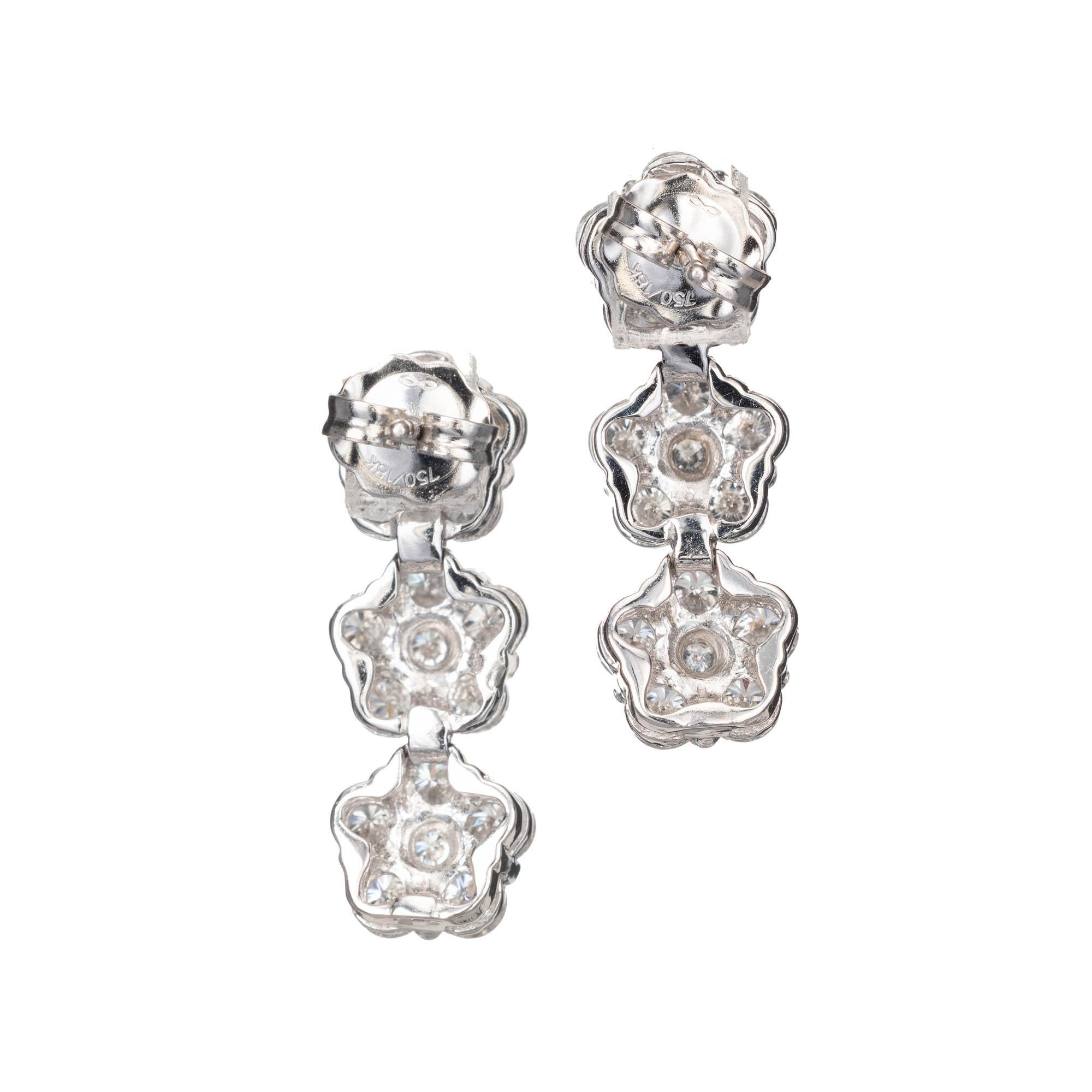 Peter Suchy 3.18ct diamond triple dangle cluster earrings in 18k white gold. 

36 round brilliant cut F-G VS diamonds, Approx. 3.18 carats
18k White Gold 
Stamped: 18k
4.8 Grams 
Top to Bottom: 21mm or .84 Inches
Width: 7.5mm or .29 Inches
Depth or