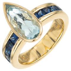 Peter Suchy Anillo de oro amarillo con aguamarina pera y zafiro de 3,19 quilates
