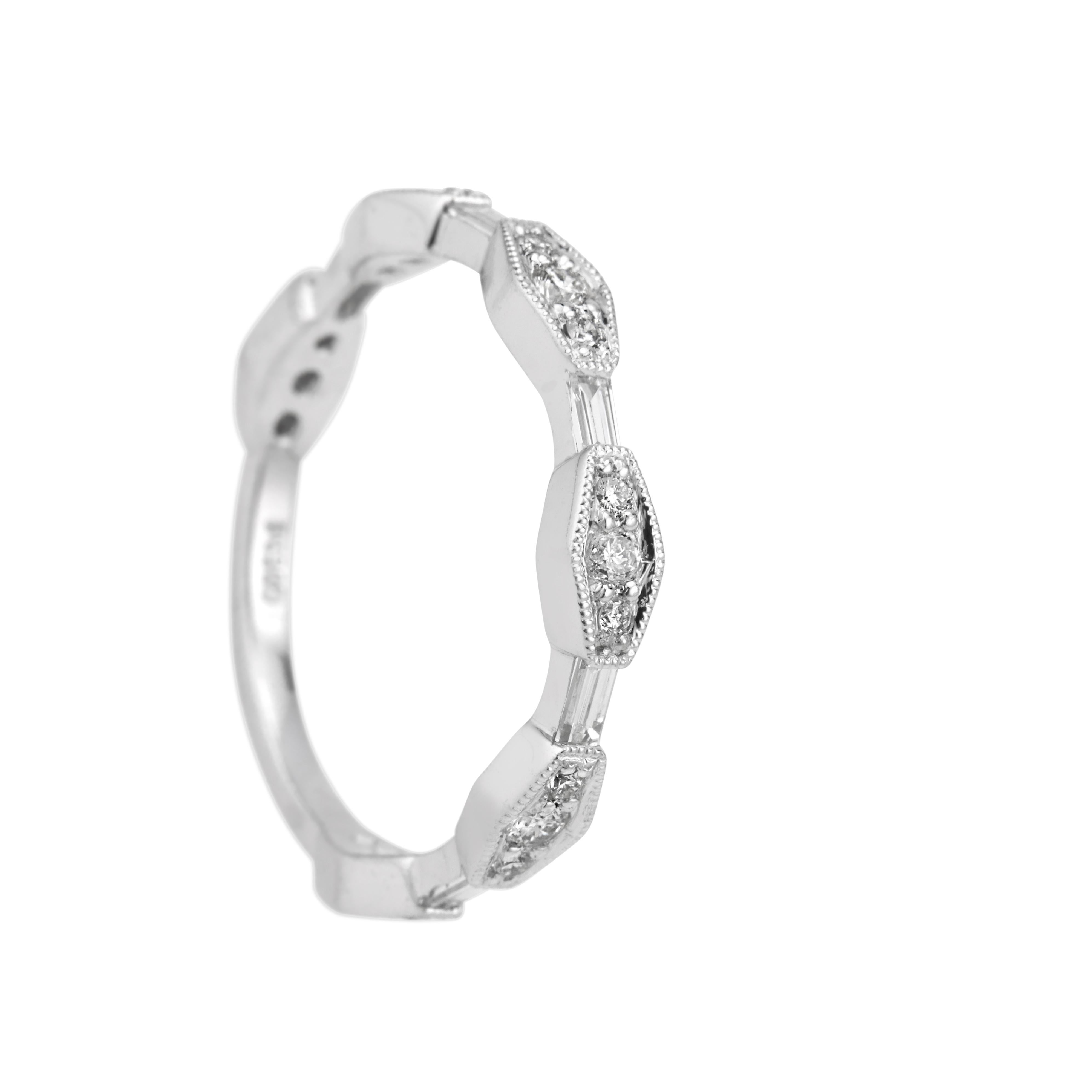 Diamond wedding band ring. 3/4 of the way around. Five baguette diamonds are separated by six groups of three round diamonds. Designed and crafted in the Peter Suchy workshop

18 round brilliant cut diamonds, G VS approx. .25cts 
5 straight cut