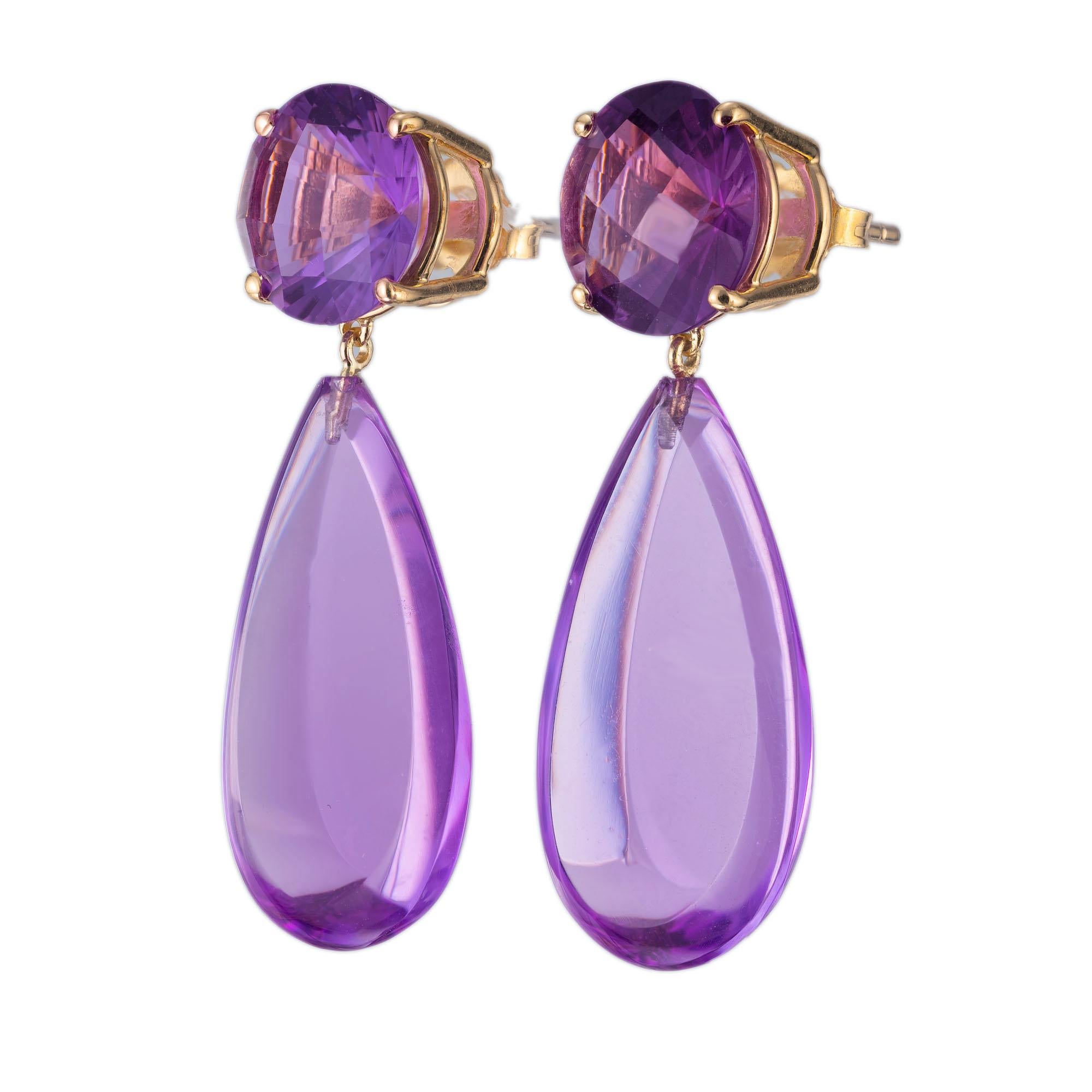 Custom cut natural amethyst dangle earrings. Two round cut amethyst tops with two pear shaped amethyst dangles set in 18k yellow gold. Crafted in the Peter Suchy Workshop. 

2 round purple amethyst, approx. 6.00cts
2 pear shape flat purple cabochon