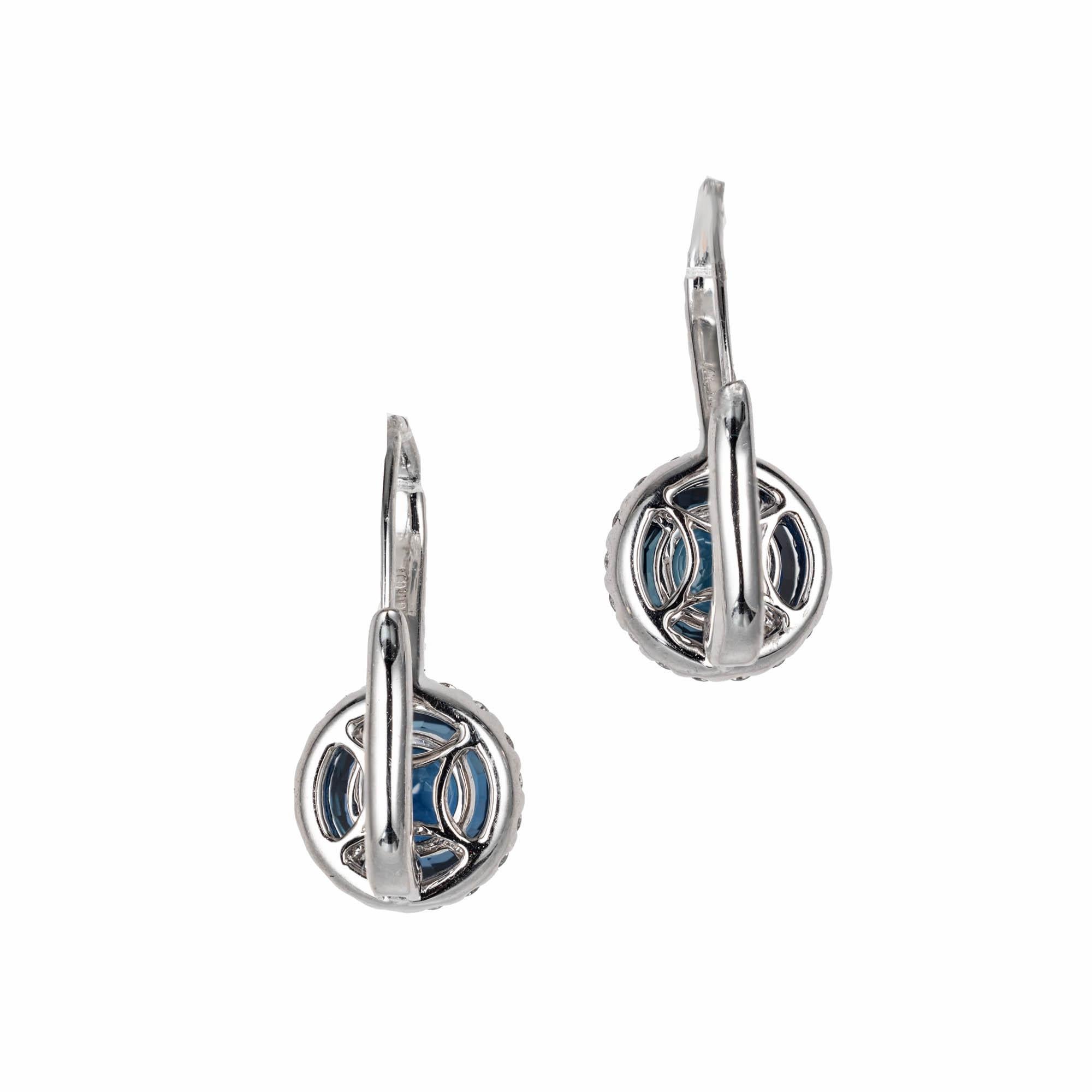 Peter Suchy  sapphire and diamond dangle earrings. Set in 14k white gold. Round sapphire surrounded by a halo of diamonds with diamonds set down front wires. Gia random tested and certified natural no heat sapphire 

2 round blue sapphire,