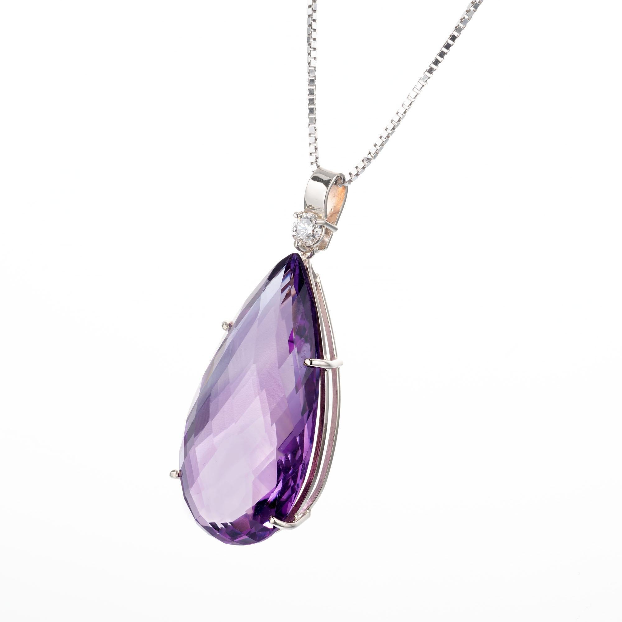 Pear shape 36.16 carat amethyst and diamond pendant necklace. Pear shaped center amethyst with a round accent diamond set in 14k white gold. Crafted in the Peter Suchy workshop. 

1 pear shape purple amethyst, approx. 36.16cts
1 round brilliant cut