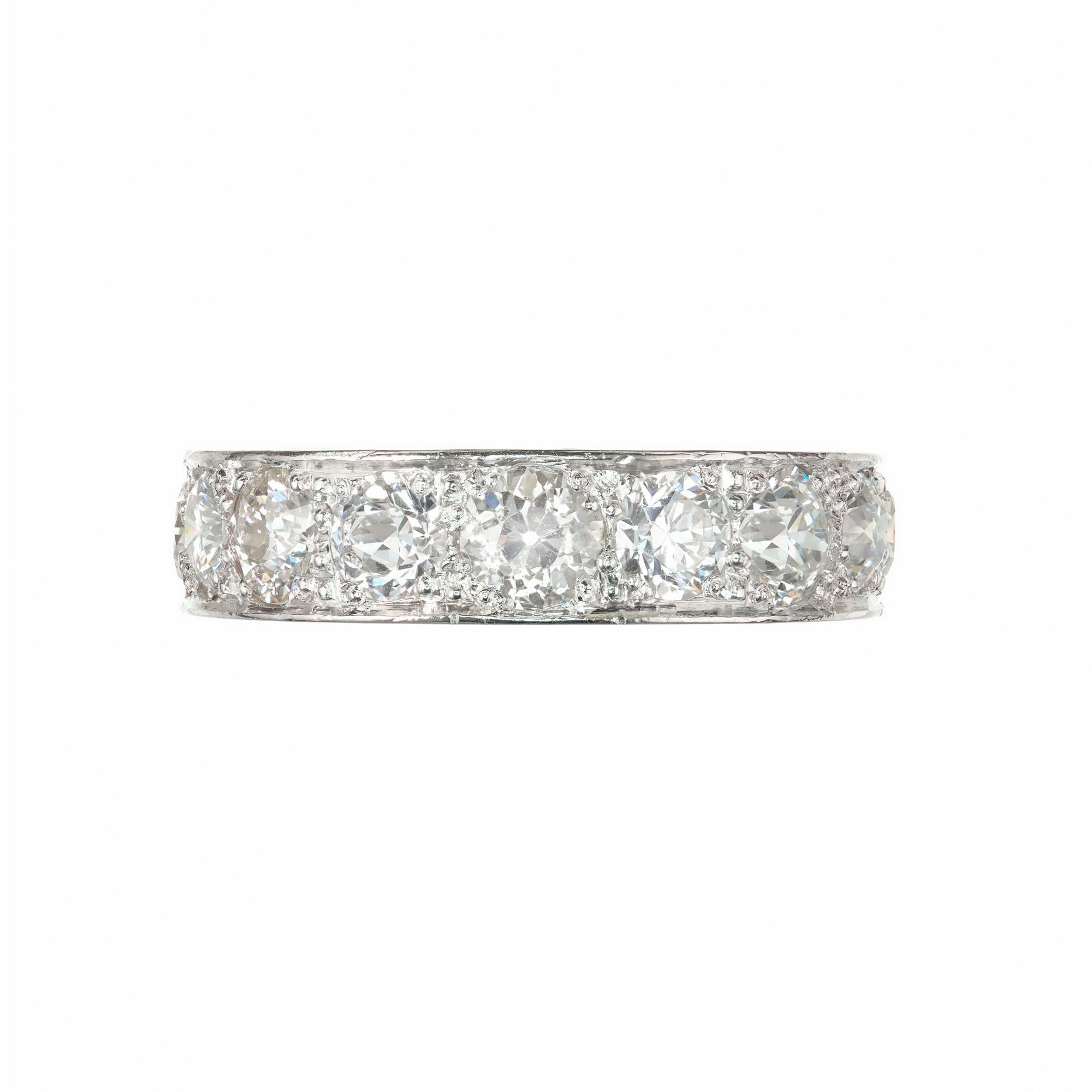 Peter Suchy vintage inspired platinum wedding band full ¾ of the way around band set with Old European cut bright sparkly diamonds. Hand engraved sides

11 Old European cut H-I-J VS-SI diamonds Approx. Total Weight 3.80cts
Size 7 and
