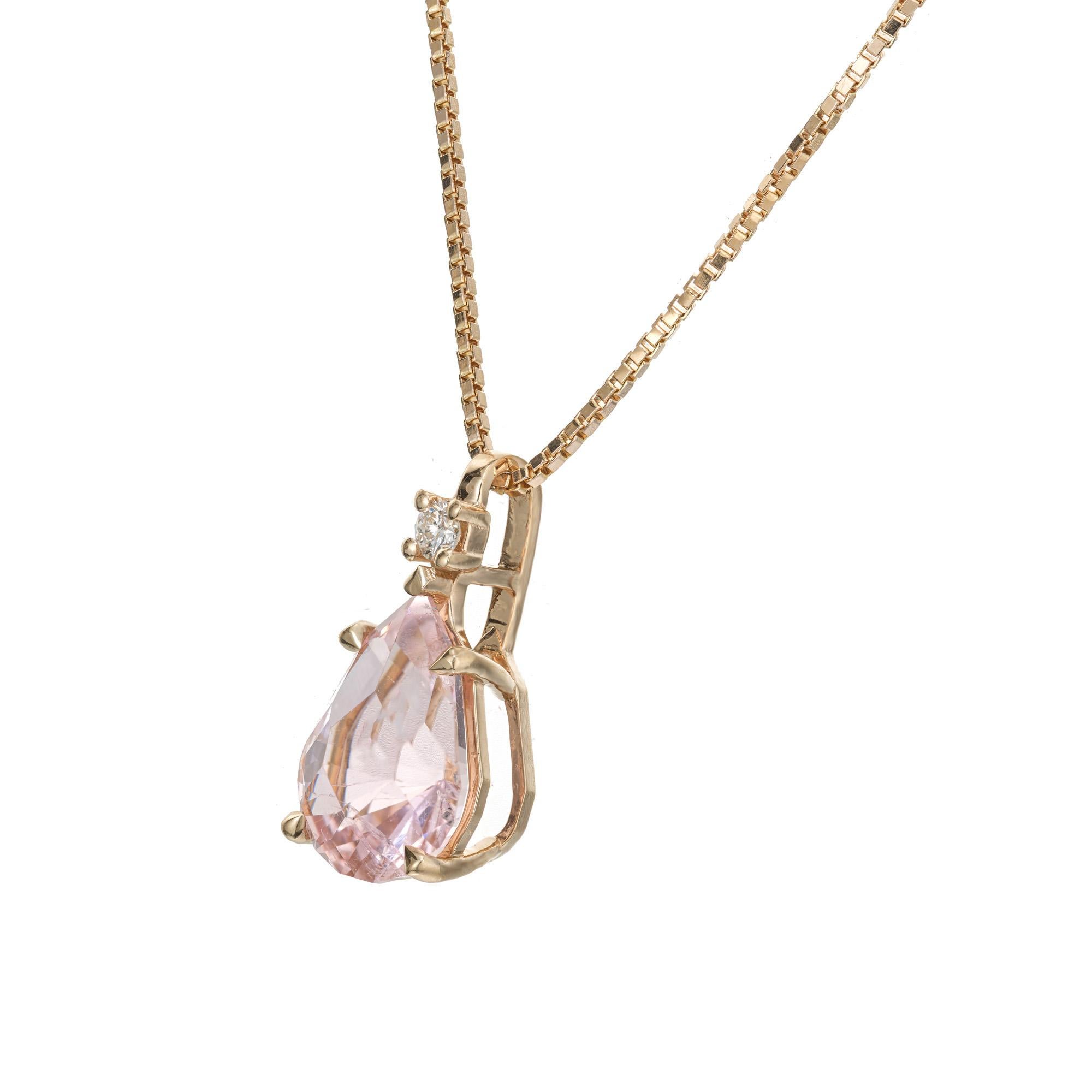 Bright pastel pink natural tourmaline diamond pendant necklace. 3.93ct pear shaped tourmaline with a round cut diamond in a 14k yellow gold setting with a 16 inch 14k yellow gold box necklace. Designed and crafted in the Peter Suchy Workshop

1 pear