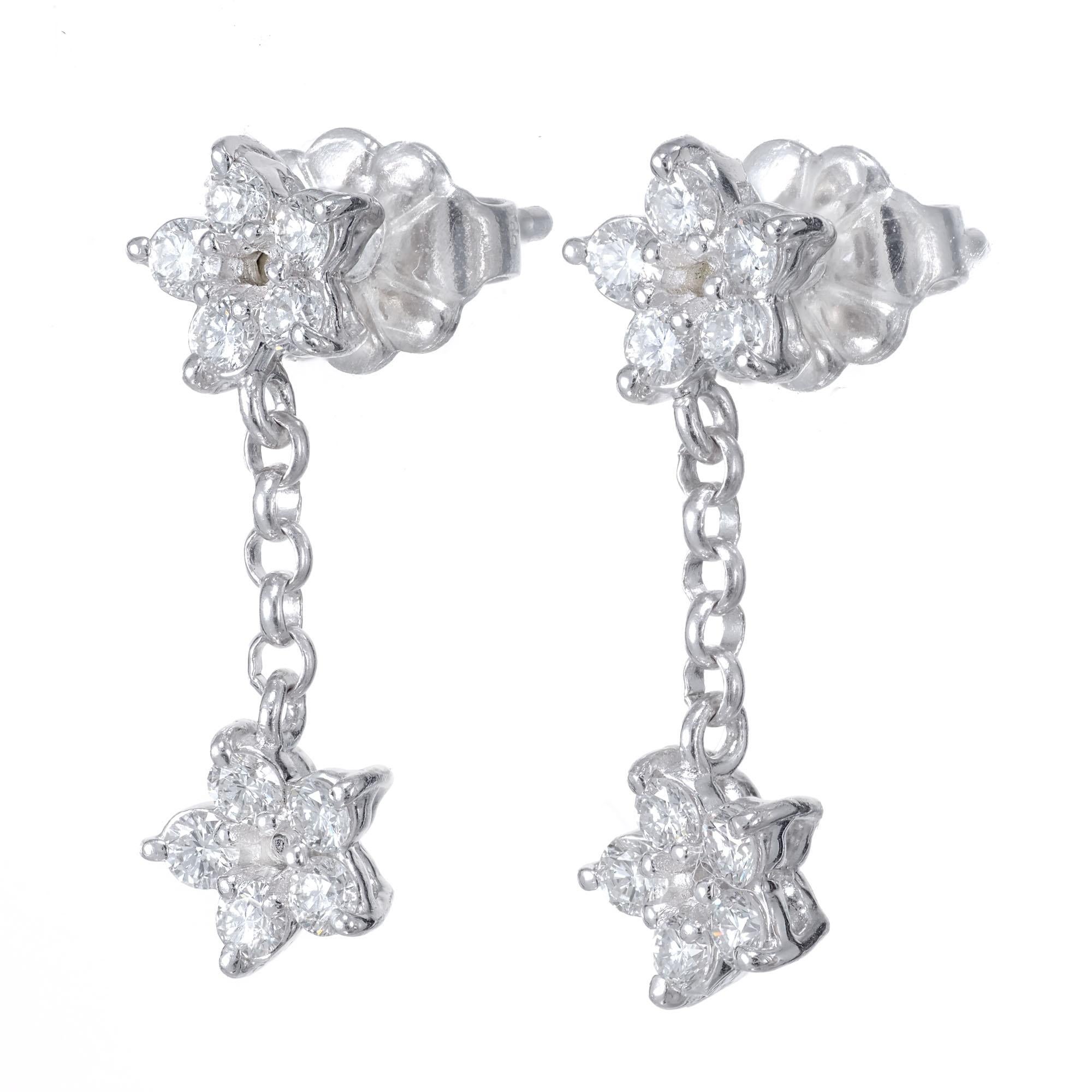 Peter Suchy petite double star design platinum dangle drop earrings.  

20 round brilliant cut diamond, F-G VS approx. .40cts
Platinum 
Stamped: PT950
2.2 grams
Top to bottom: 16.9mm or .66 inch
Width: 5.5mm or .75 Inch
Depth or thickness: 2.2mm
