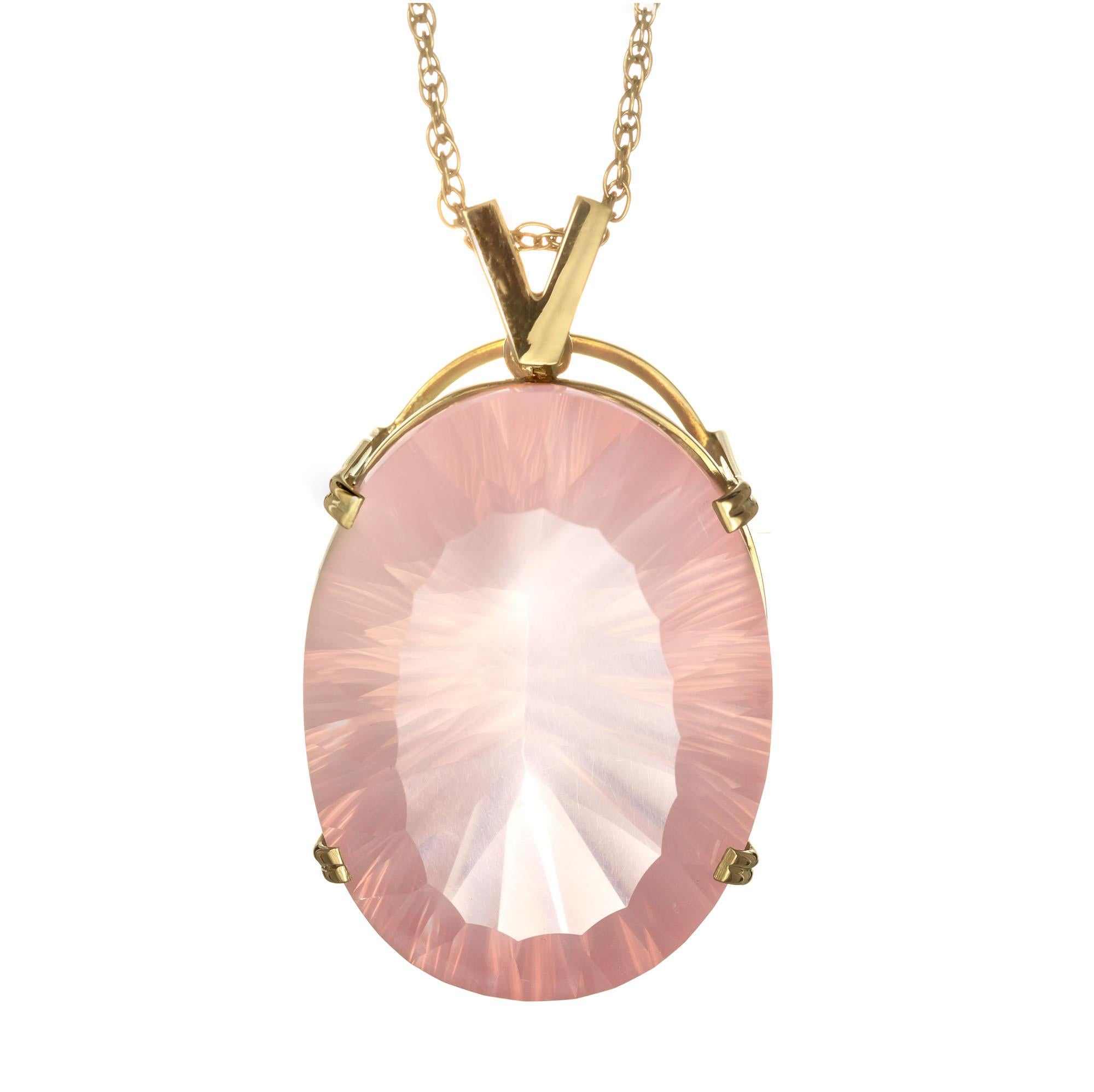 47.04 carat translucent pear milky rose oval quartz pendant necklace set in 14k yellow gold from the Peter Suchy Workshop. 

1 oval pink rose quartz, approx. 47.04cts
14k yellow gold 
Stamped: 14k
14.4 grams
Top to bottom: 37.1mm or 1 7/16