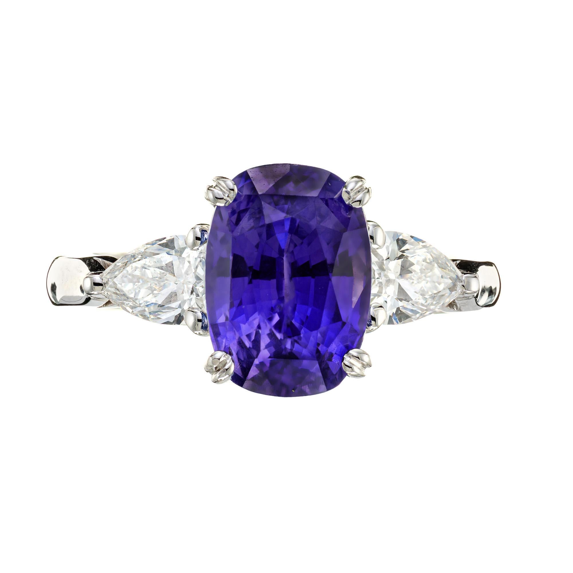 Elongated cushion cut natural no heat GIA certified color change Sapphire and diamond engagement ring. 4.73 Carat cushion cut sapphire center stone set in a platinum setting with 2 pear shaped accent diamonds. Changes from blue to violet in