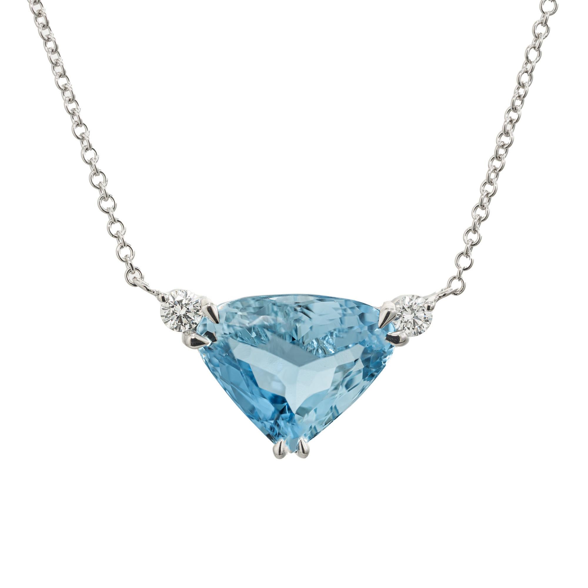 Aqua and diamond pendant necklace. Triangular shape 4.94ct. aquamarine set in 14k white gold with 2 round brilliant cut accent diamonds. 18 inch 14k white gold chain. A captivating piece that effortlessly combines elegance and sophistication.