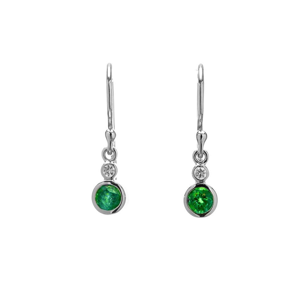 Natural emerald and diamond dangle earrings. 2 round bezel set emeralds in 14k white gold settings with 2 round brilliant cut bezel set diamonds. Designed and crafted in the Peter Suchy Workshop.

2 round emeralds, approx. total weight .52cts 
2