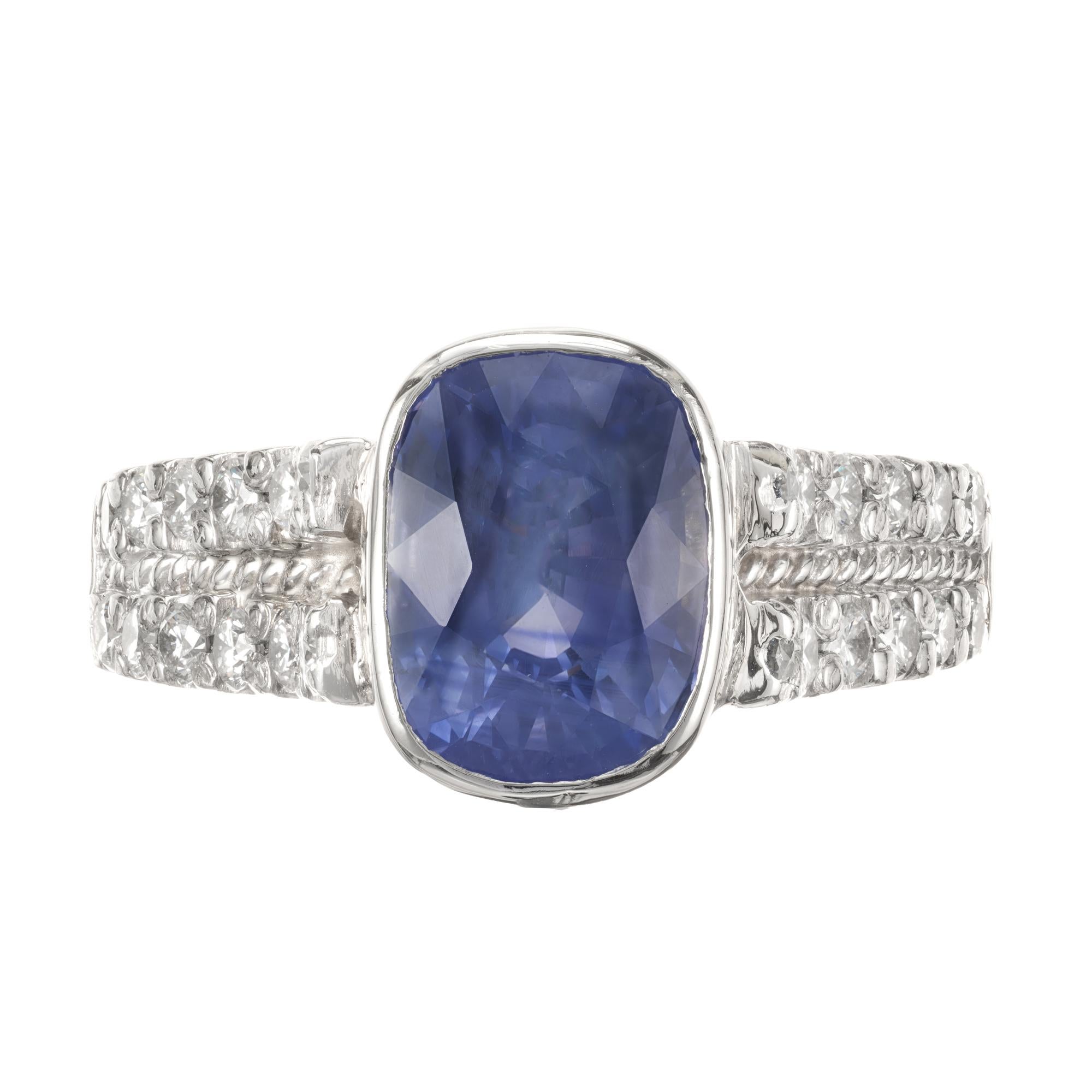 Antique cushion cut soft medium blue genuine Ceylon sapphire and diamond engagement ring. GIA Certified center stone. Natural color, simple heat only, no other enhancements GIA # 2155636352. Platinum ring with two rows of diamonds that come up to