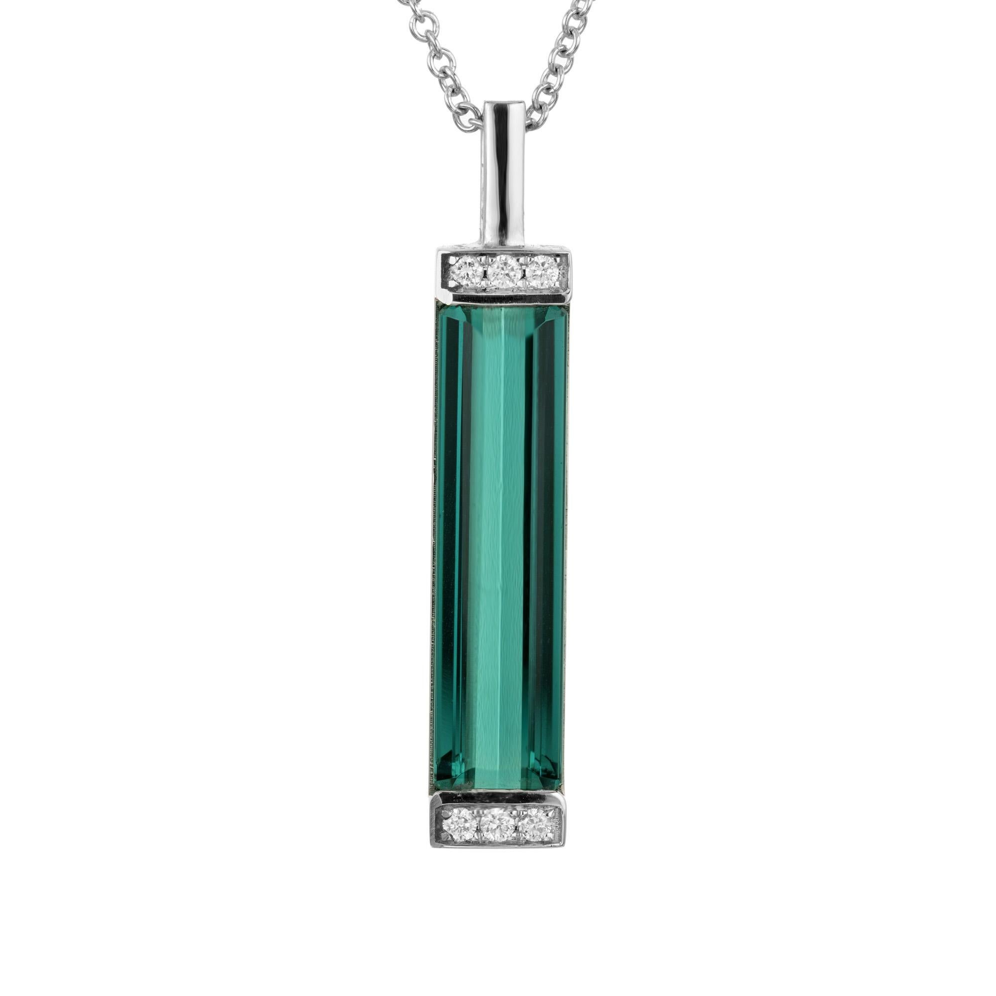 Wonderful bright greenish blue natural elongated 5.24 carat emerald cut tourmaline pendant in 18k white gold with sparkly diamond accents. This stunning 18 inch necklace features a magnificent rectangular tourmaline gemstone which is accented by