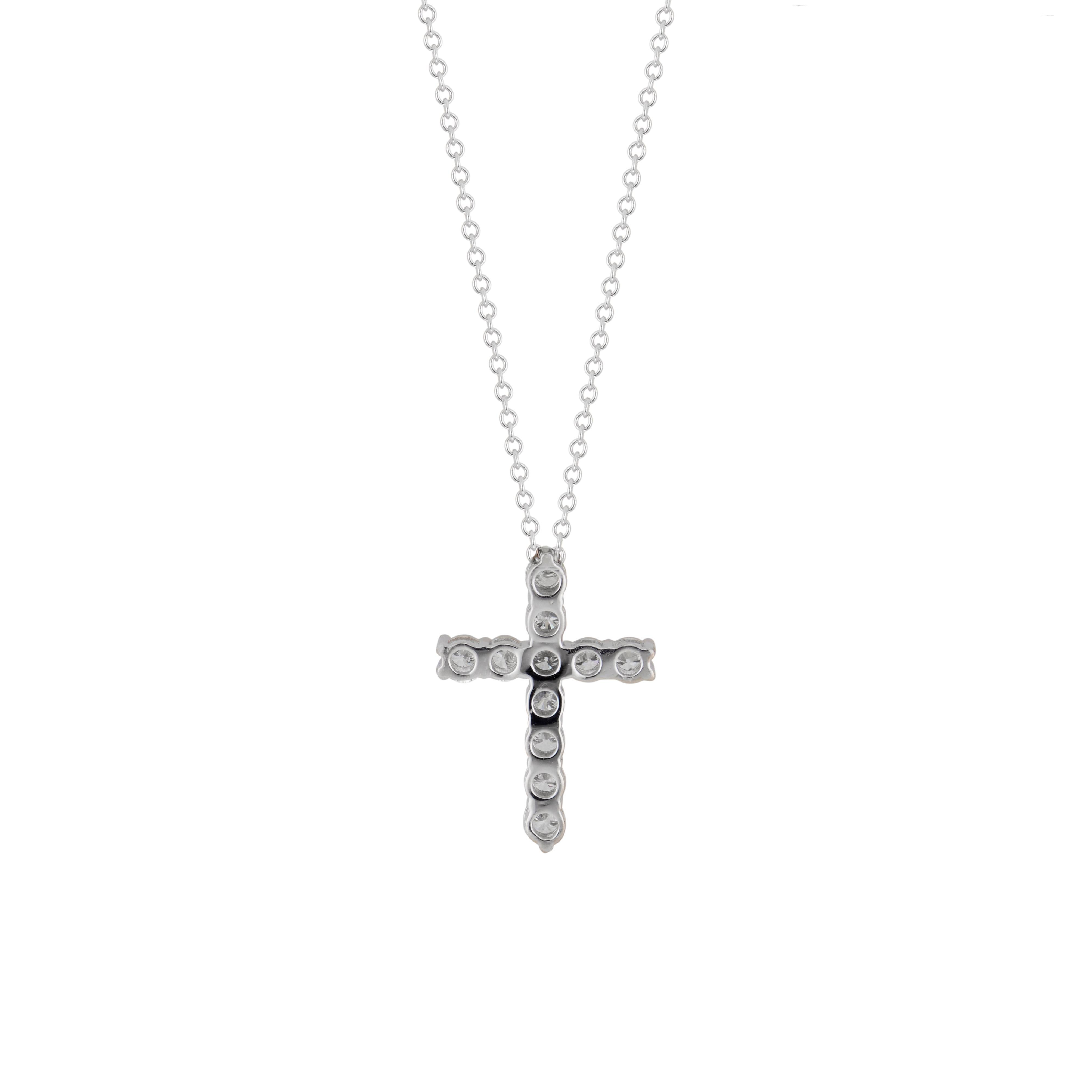 Diamond  classic common prong cross in platinum with 11 round brilliant cut diamonds. 18 inch chain. Designed and crafted in the Peter Suchy workshop. 

11 round brilliant cut diamonds, F VS approx. .53cts
Platinum 
Stamped: 950
4.4 grams
Top to