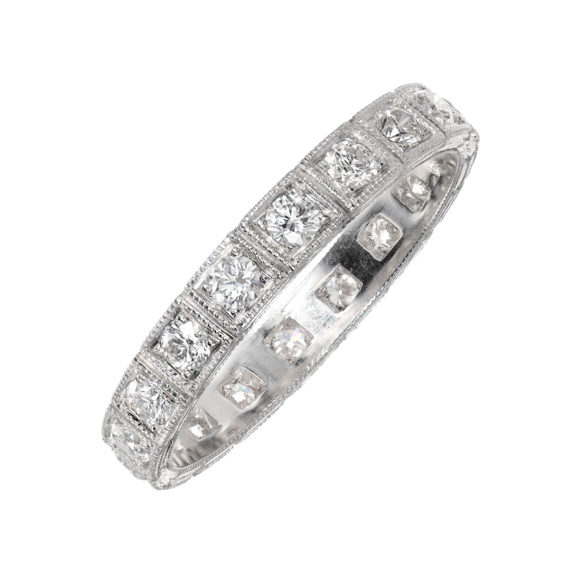 Diamond platinum wedding band ring. 18 full cut diamonds, bead set and hand engraved sides. Made in the Peter Suchy Workshop. 

18 full cut round brilliant cut diamonds, approx. total weight .54cts, F, VS2
Size 6 and sizable
Platinum
Tested: