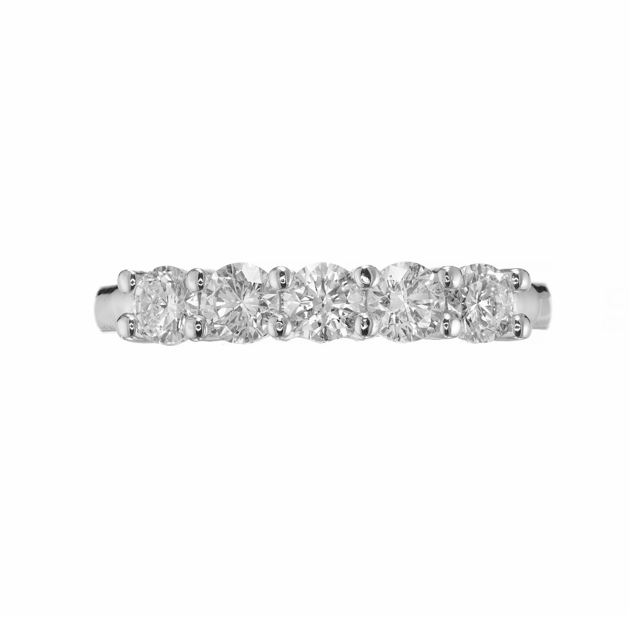Five round brilliant cut in a classic custom common platinum prong setting. Created in the Peter Suchy Workshop.

5 round brilliant cut diamonds, G-H VS-SI approx. .54cts
Size 6.5 and sizable 
Platinum 
Stamped: PLAT
4.5 grams
Width at top:
