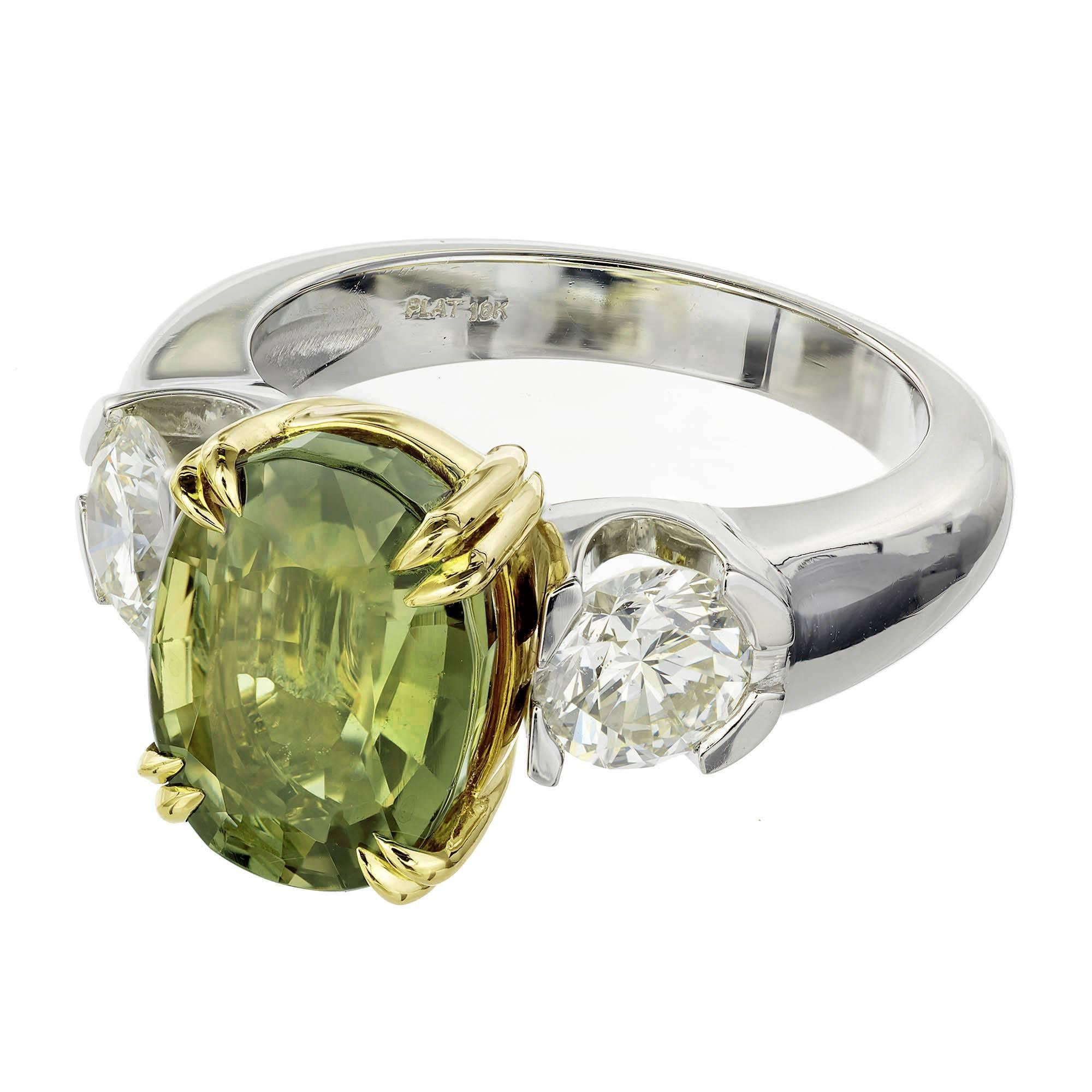 GIA certified natural oval Alexandrite and diamond three-stone engagement ring. moderate color change. The Alexandrite is from an estate. The platinum and 18k yellow gold setting is handmade in the Peter Suchy workshop.

1 natural yellowish green,