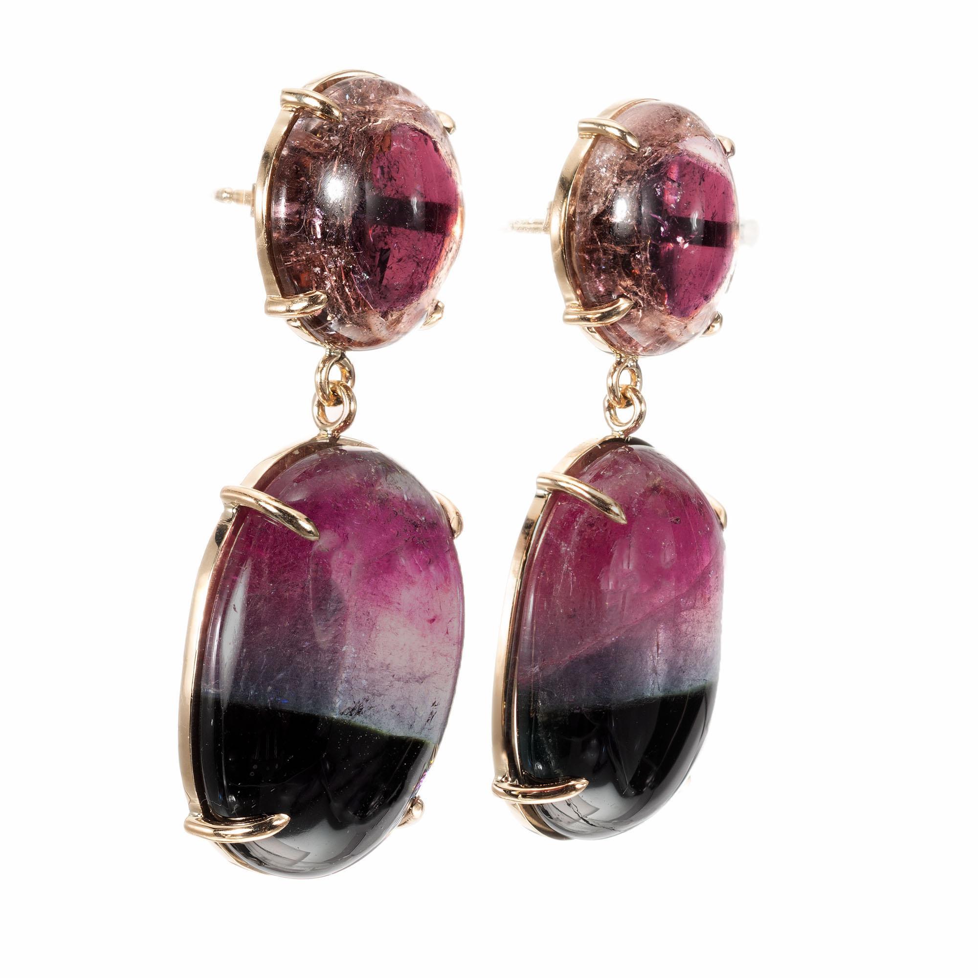 Watermelon cabochon tourmaline earrings. 2 round top tourmalines with 2 oval tourmaline dangles in 14 yellow gold settings. Crafted in the Peter Suchy Workshop 

2 round cabochon tourmalines, approx. total weight: 12.54cts
2 oval cabochon